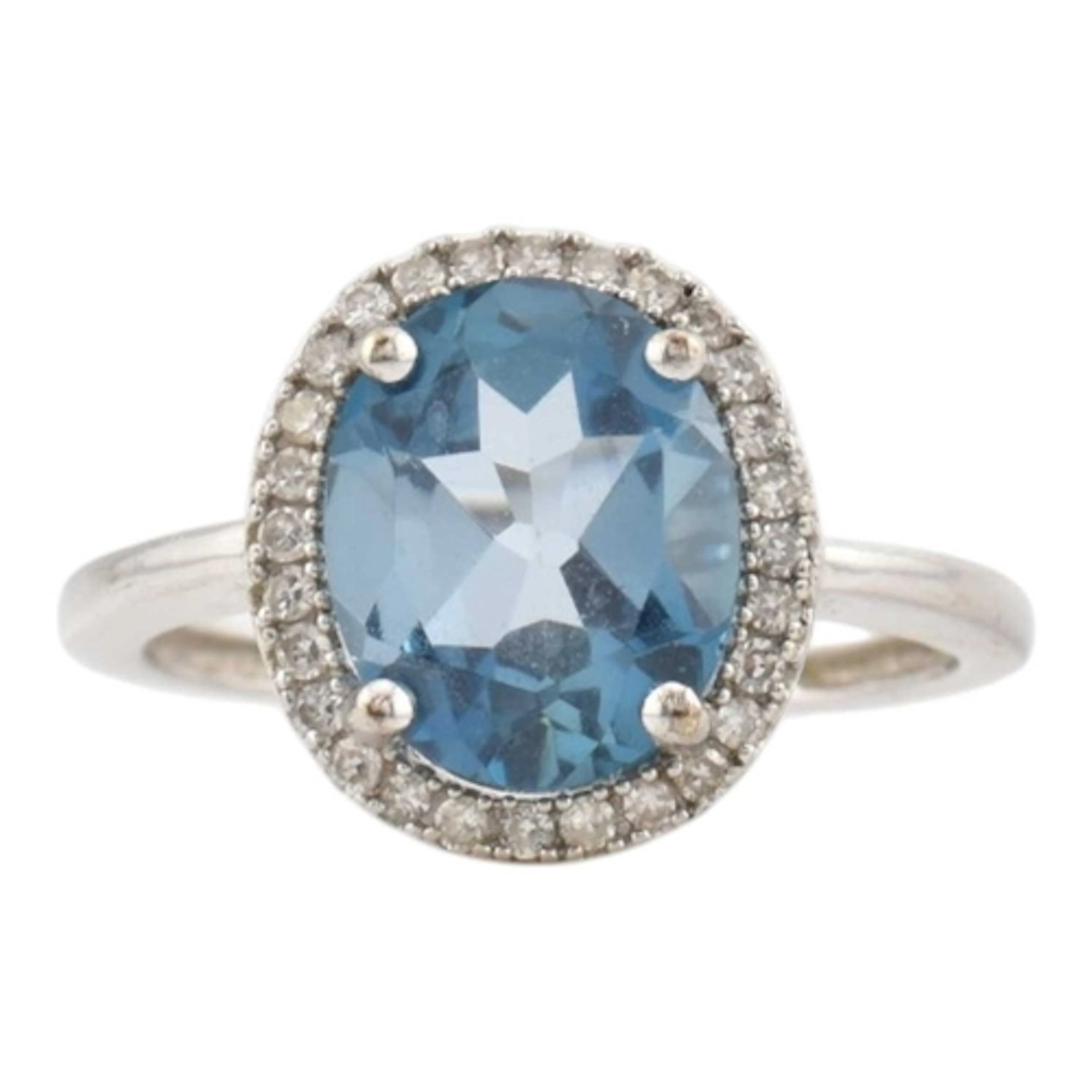 A hallmarked 9ct white gold, blue topaz and diamond ring. Se...