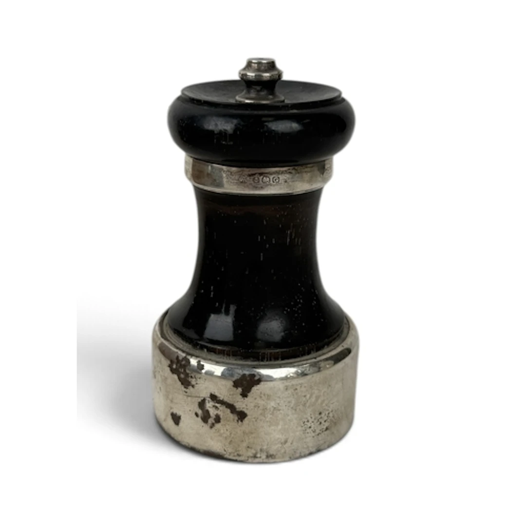 A SILVER MOUNTED PEPPER MILL