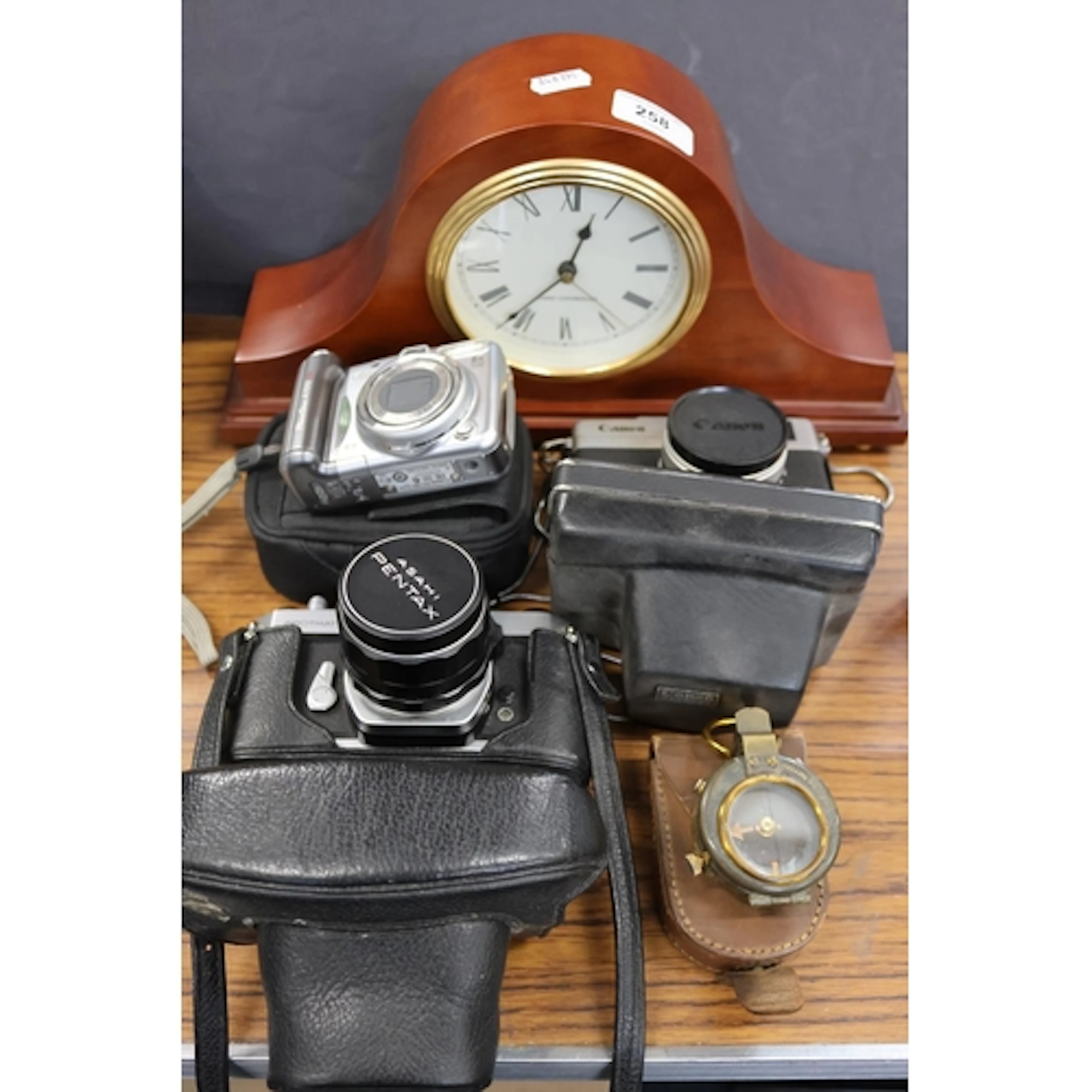 Cameras to include Pentax and Canon, a cased compass, and a ...