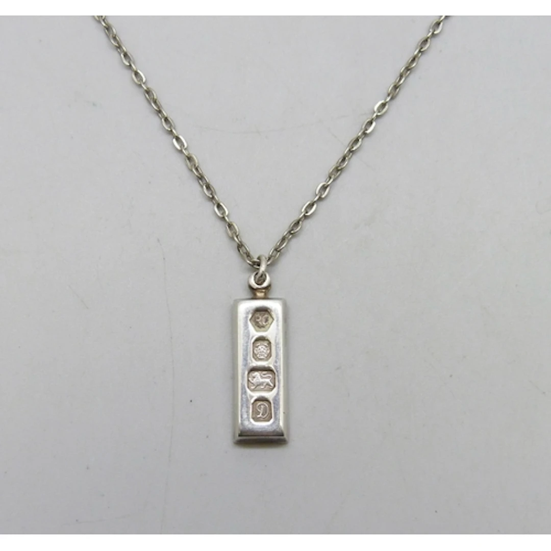 A small silver ingot, Sheffield, 1978, on a silver plated ch...