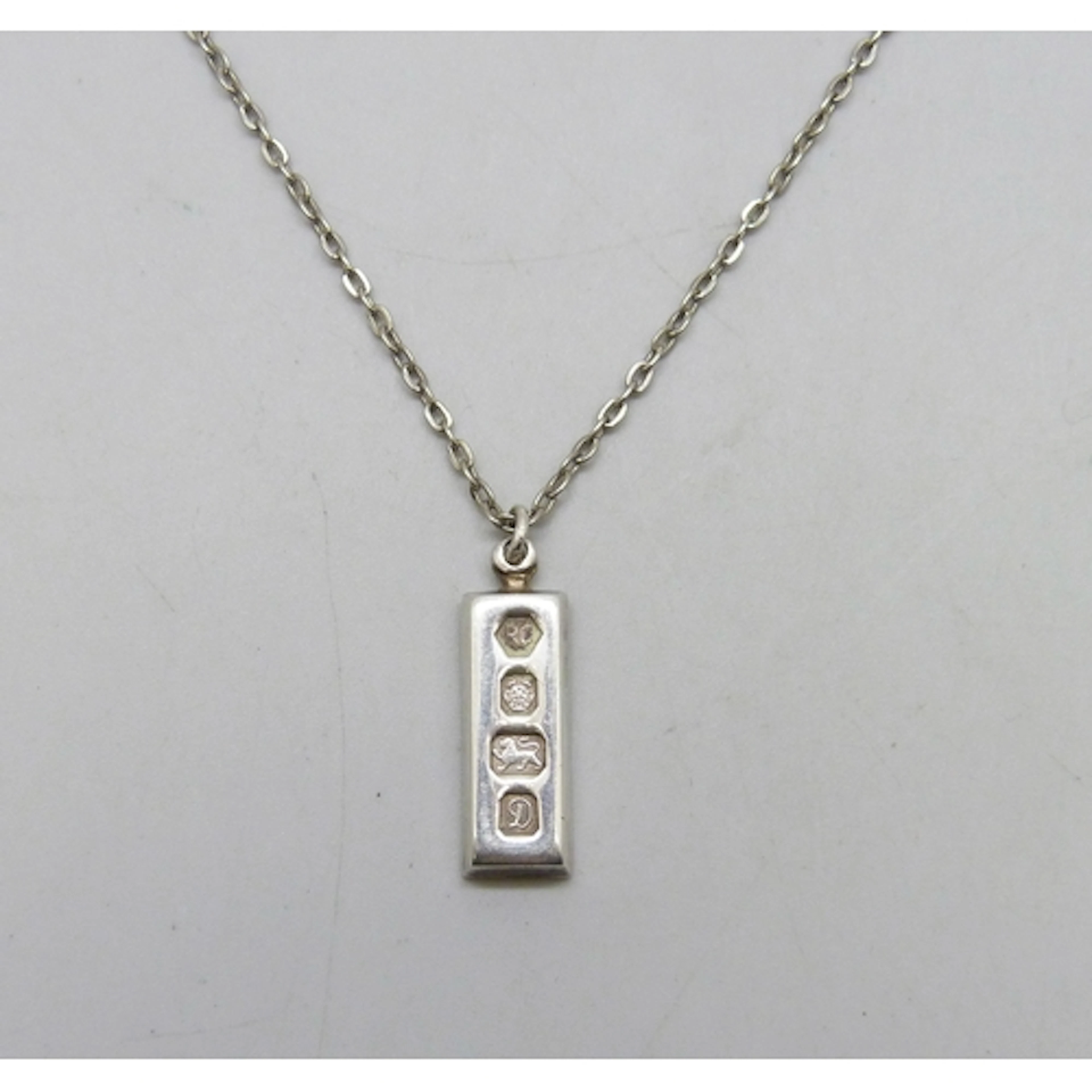 A small silver ingot, Sheffield, 1978, on a silver plated ch...