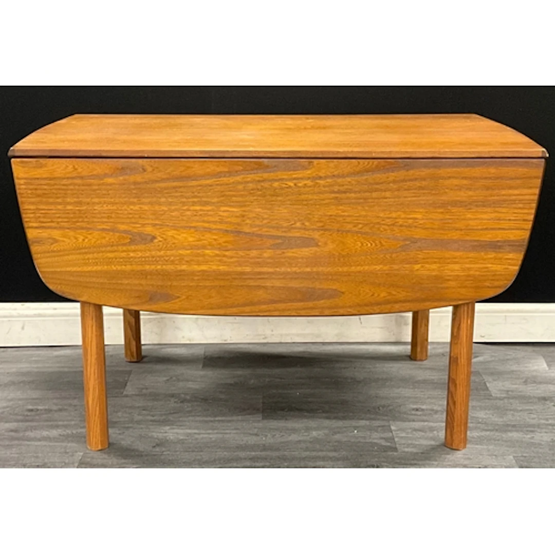 A mid century teak G-plan drop leaf dining table, with two r...