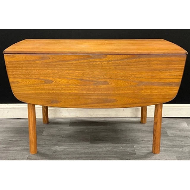 A mid century teak G-plan drop leaf dining table, with two r...