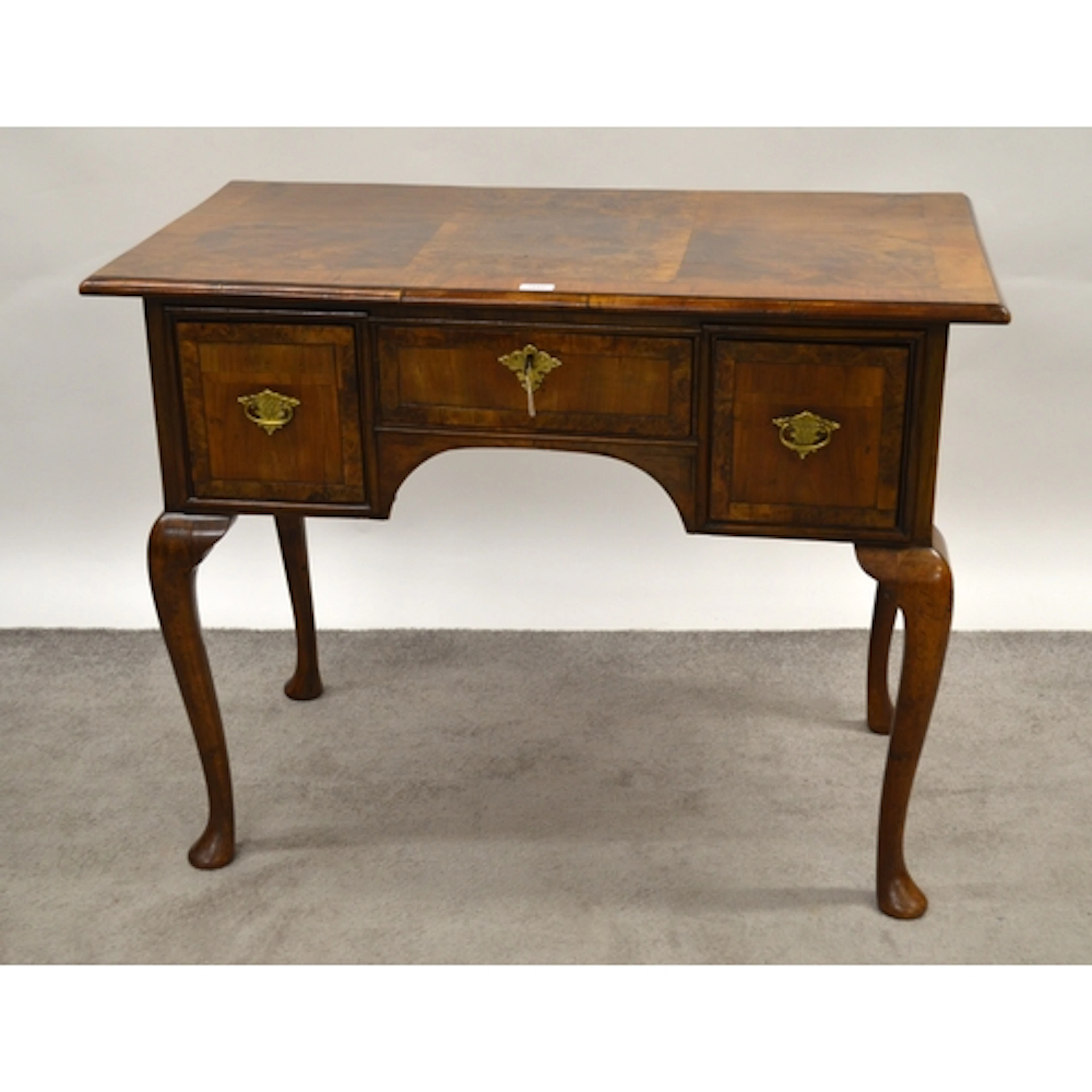 Antique walnut lowboy, having crossbanded top, above three d...