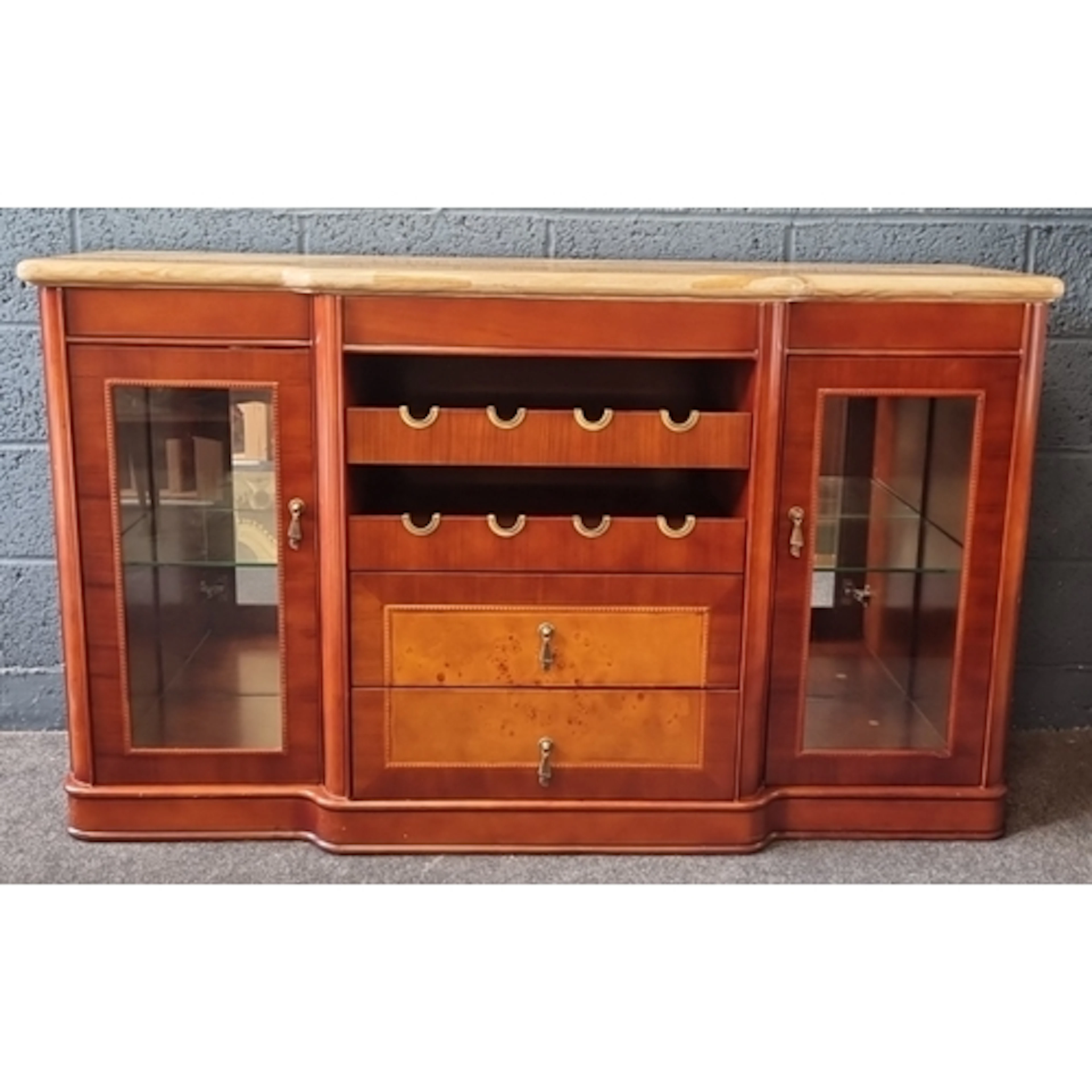 Mahogany breakfront sideboard with pale marble top, twin gla...