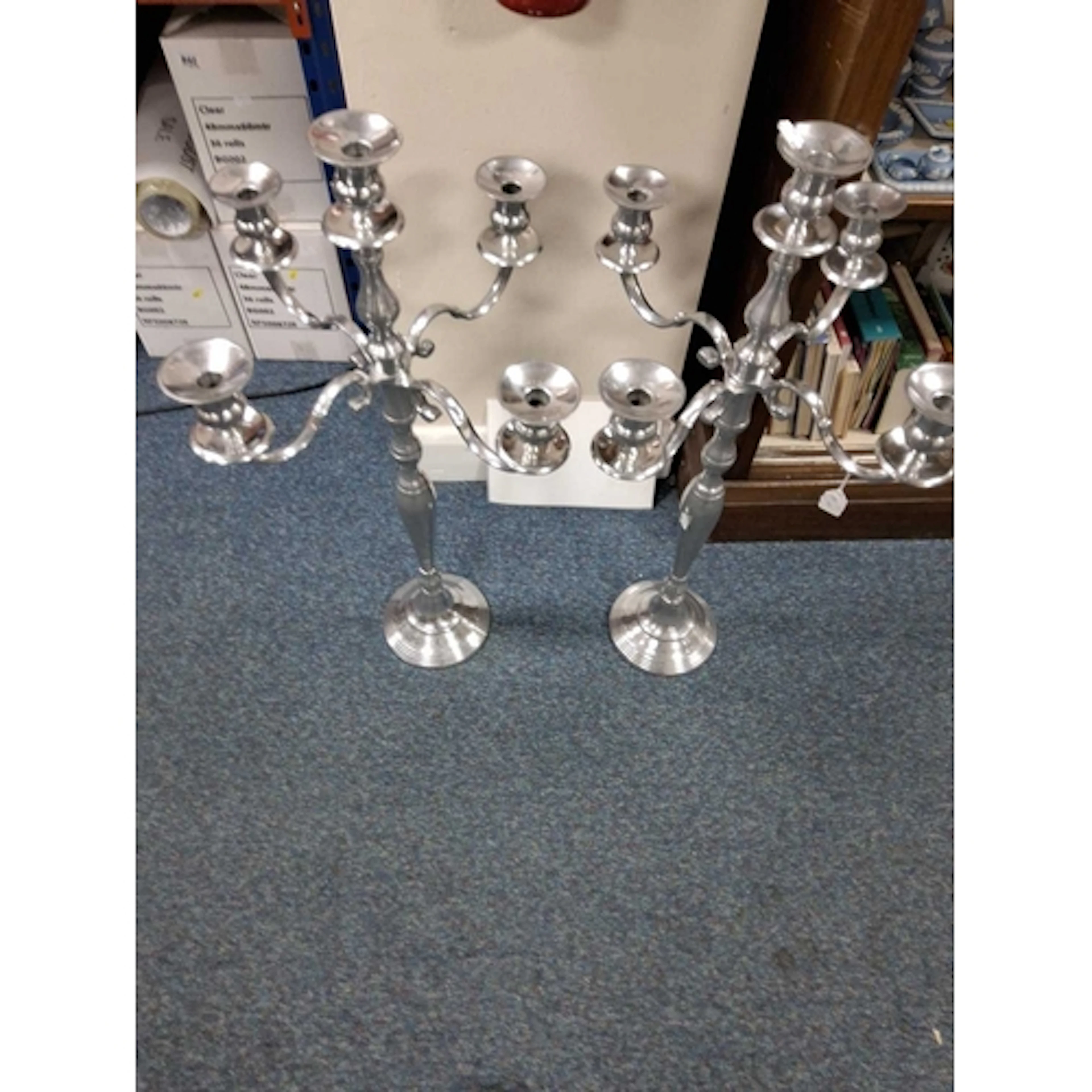 A PAIR OF TALL VINTAGE SILVER COLOURED METAL FIVE SCONCE CAN...