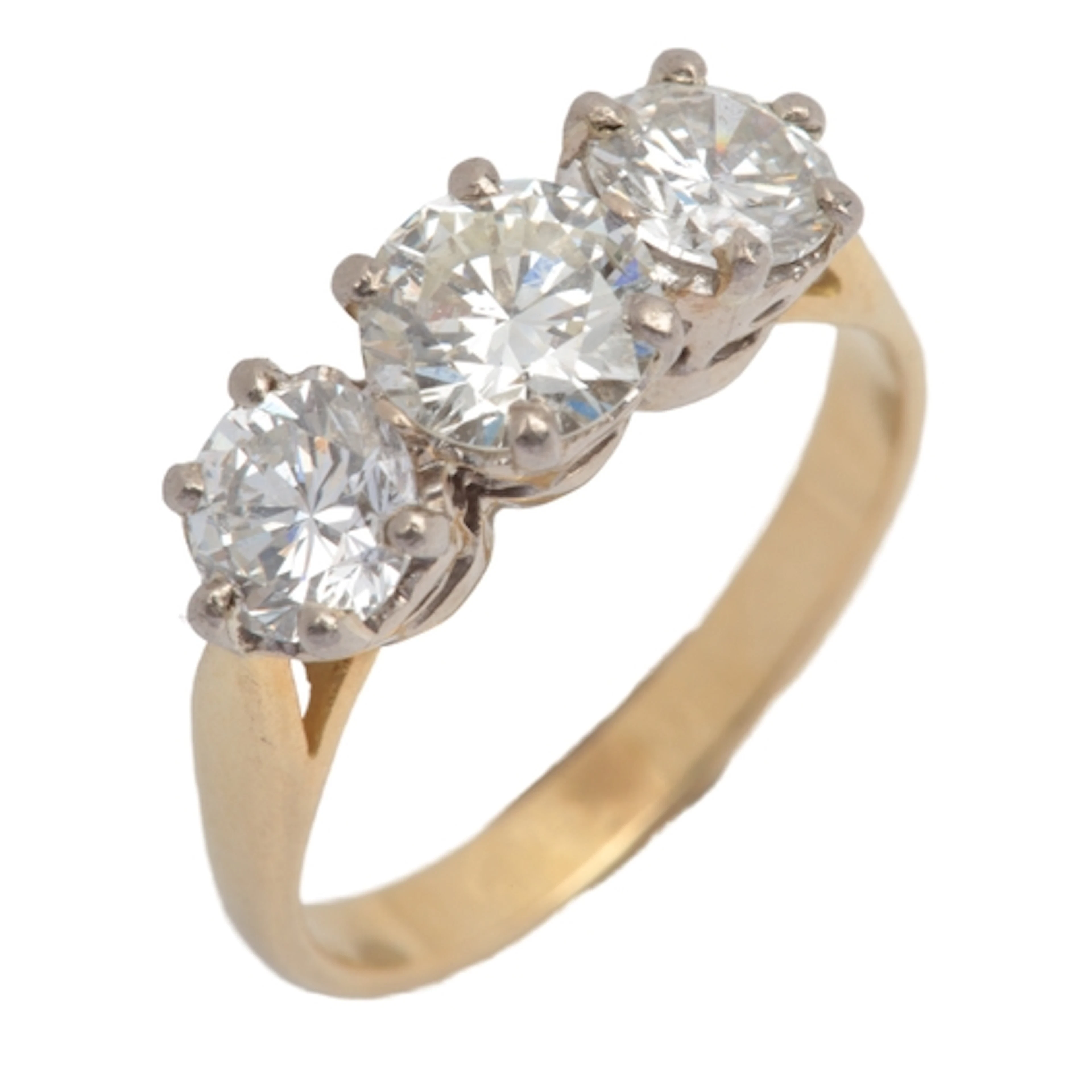 A three-stone diamond ring, claw-set with three brilliant-cu...