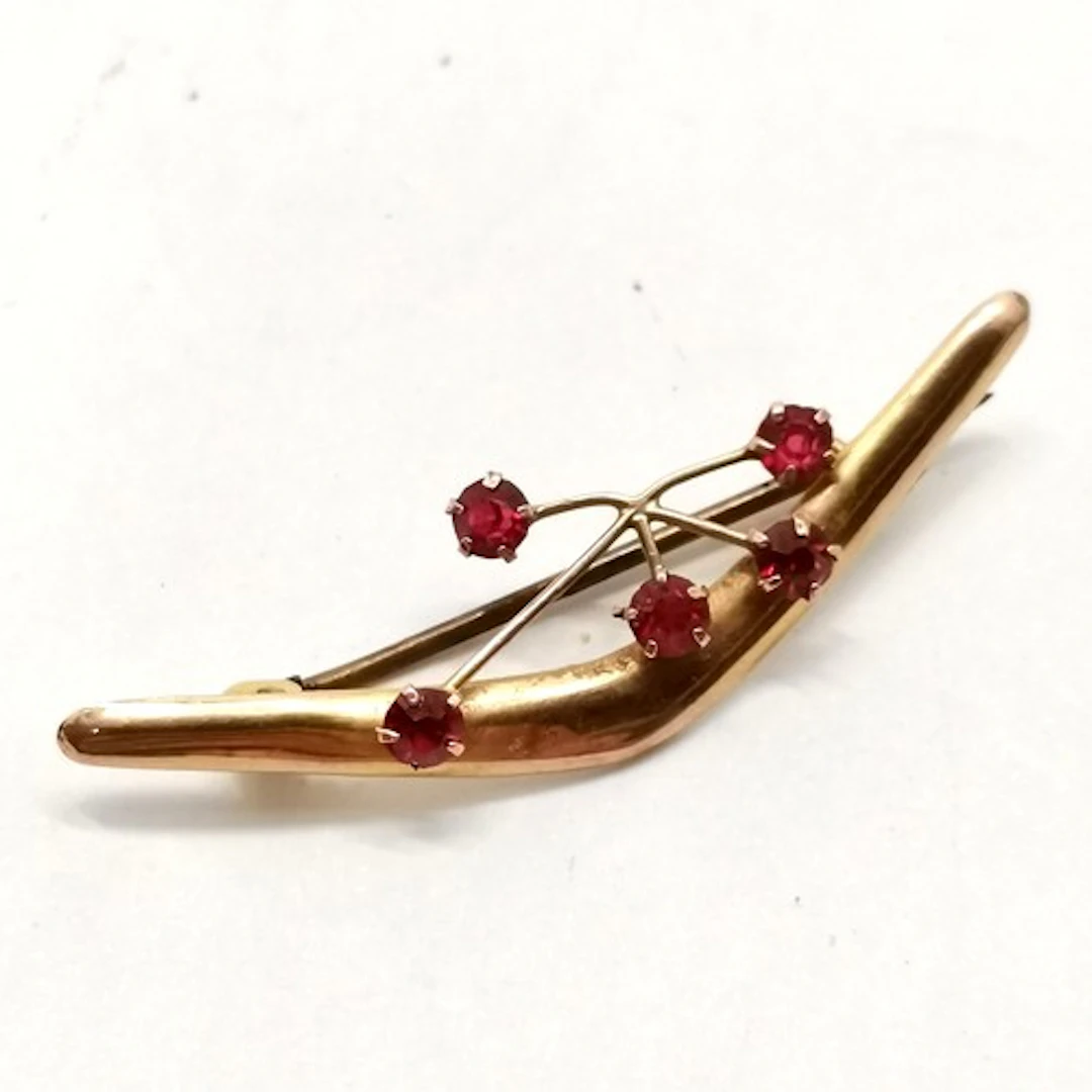 Antique 9ct marked gold Australian boomerang & red stone set...