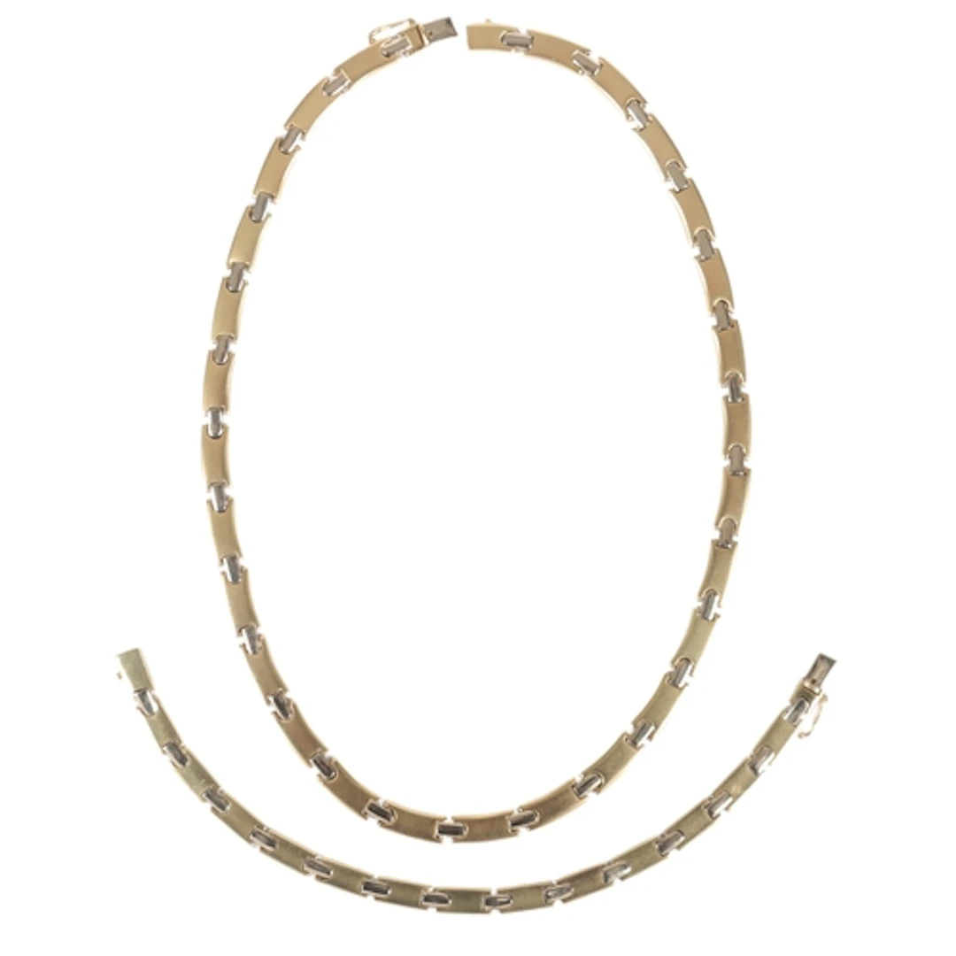 A gold demi-parure, comprising: a necklace and bracelet, eac...