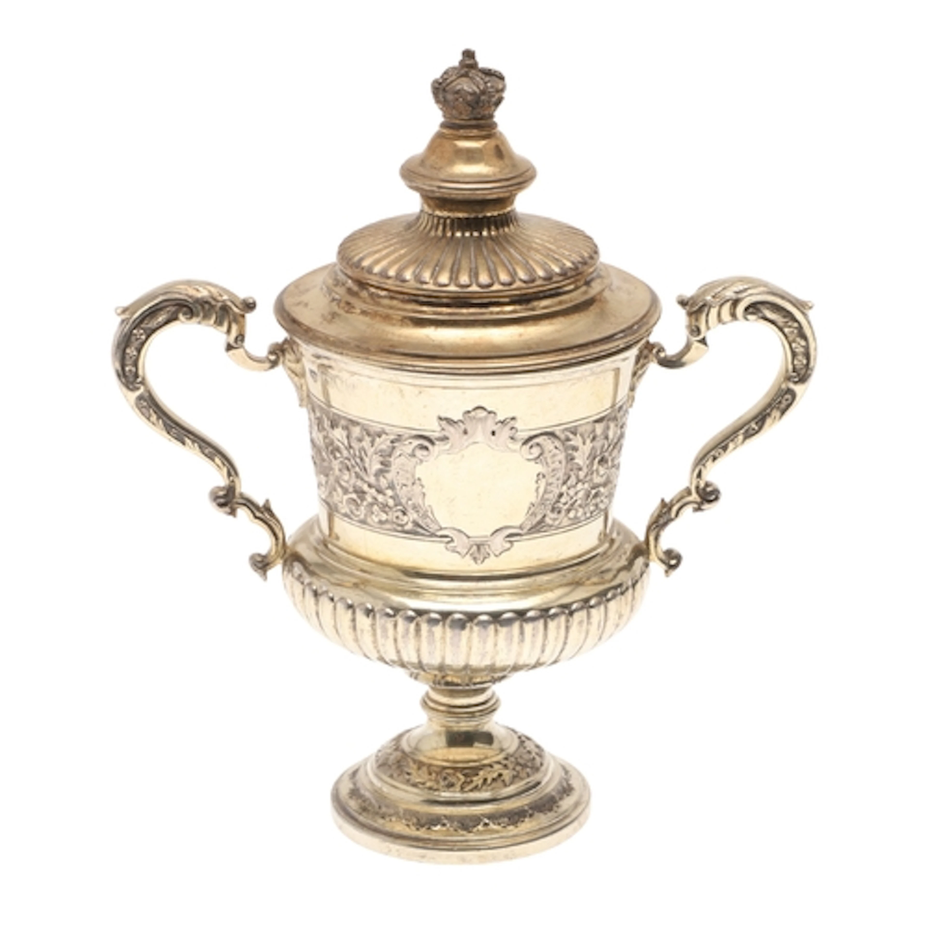 A LATE VICTORIAN SILVER GILT TROPHY CUP. With twin scroll ha...