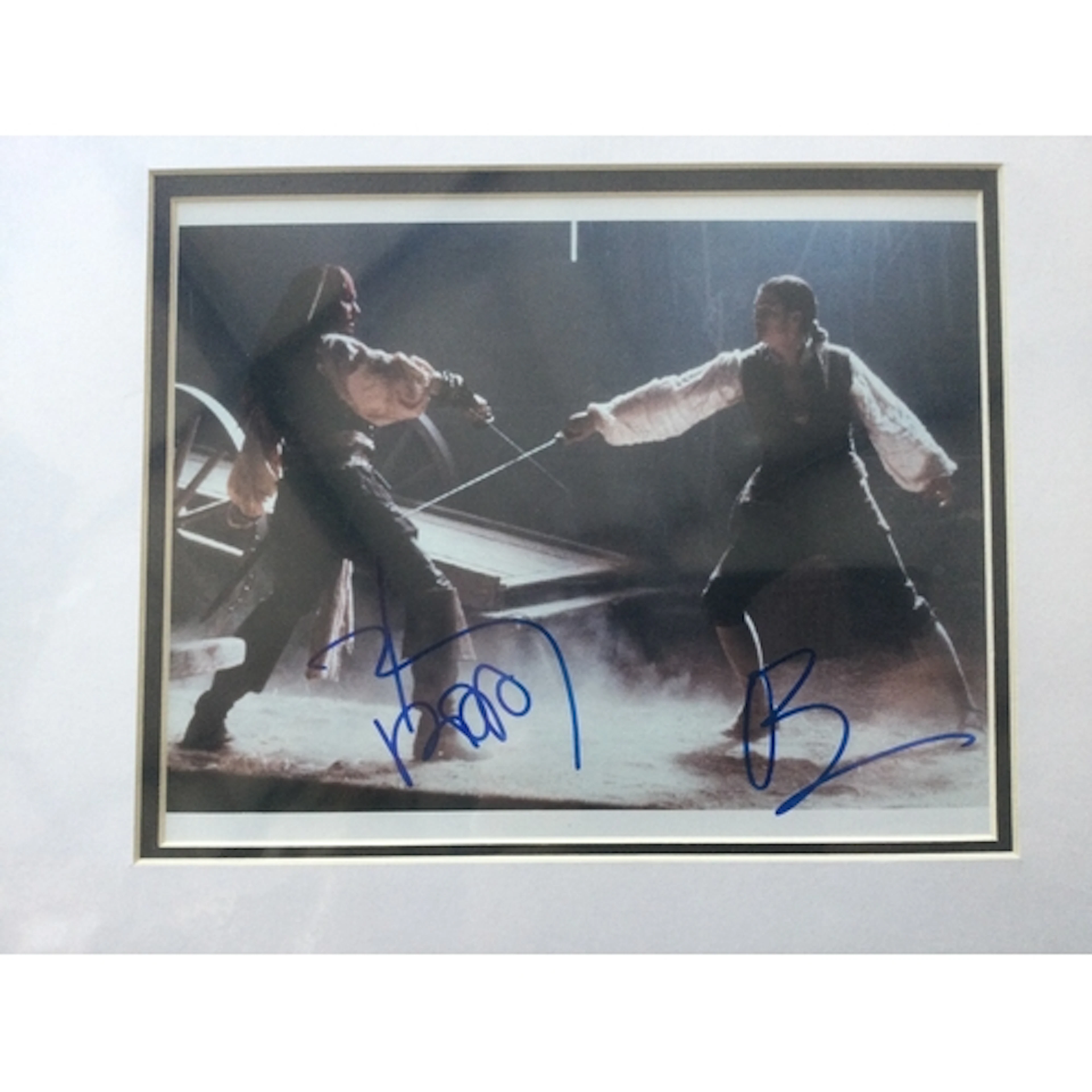 A Johnny Depp and Orlando Bloom signed photo from Pirates Of...