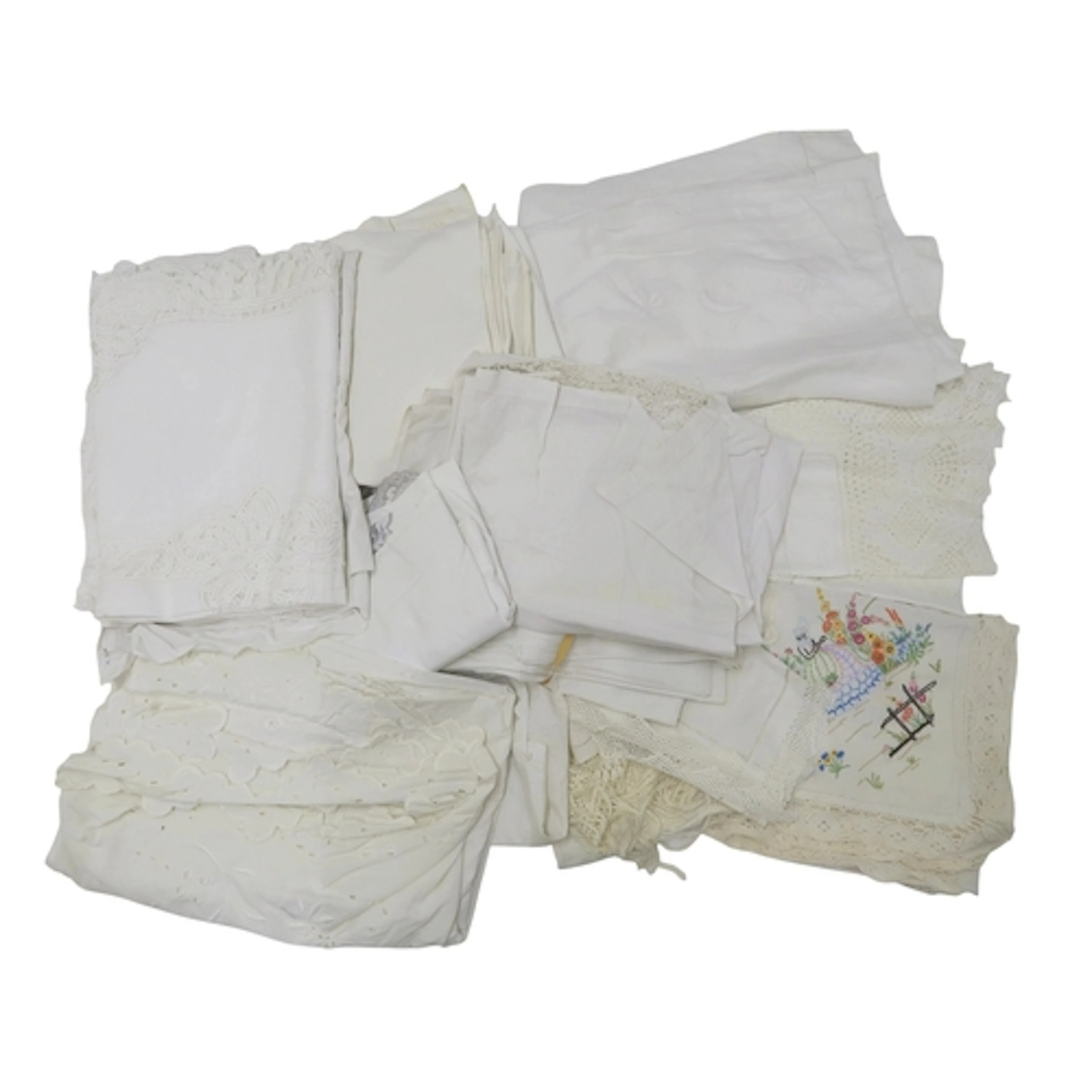 A collection of linens including embroidered and lace table ...