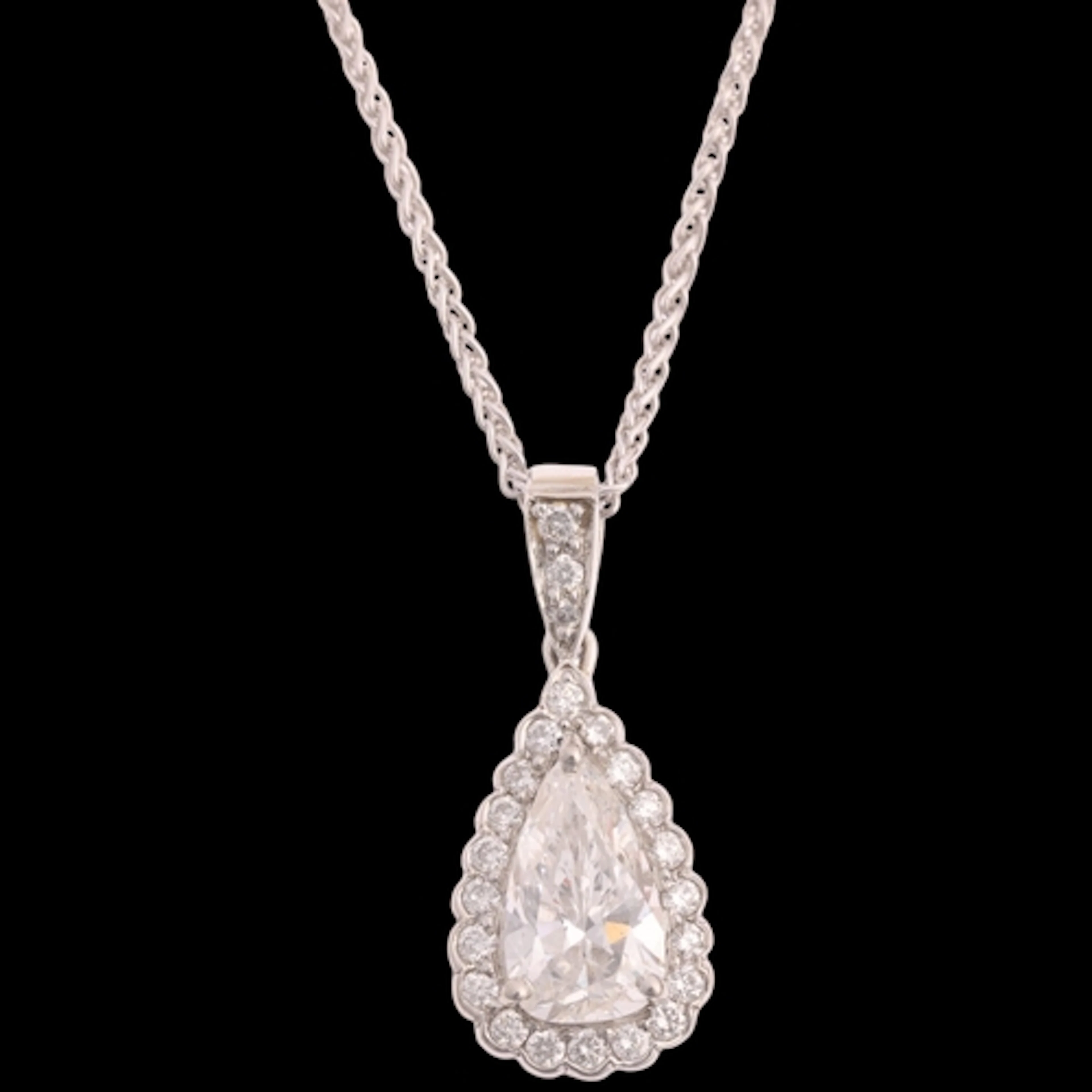 A platinum diamond pear cluster pendant necklace, claw set w...