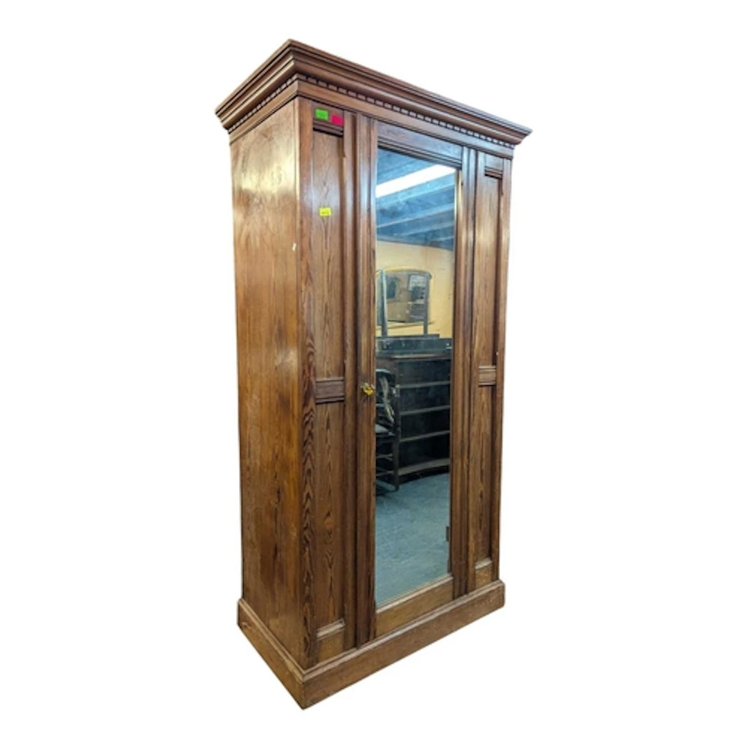 Edwardian oak single wardrobe. Cornice atop a single mirrore...