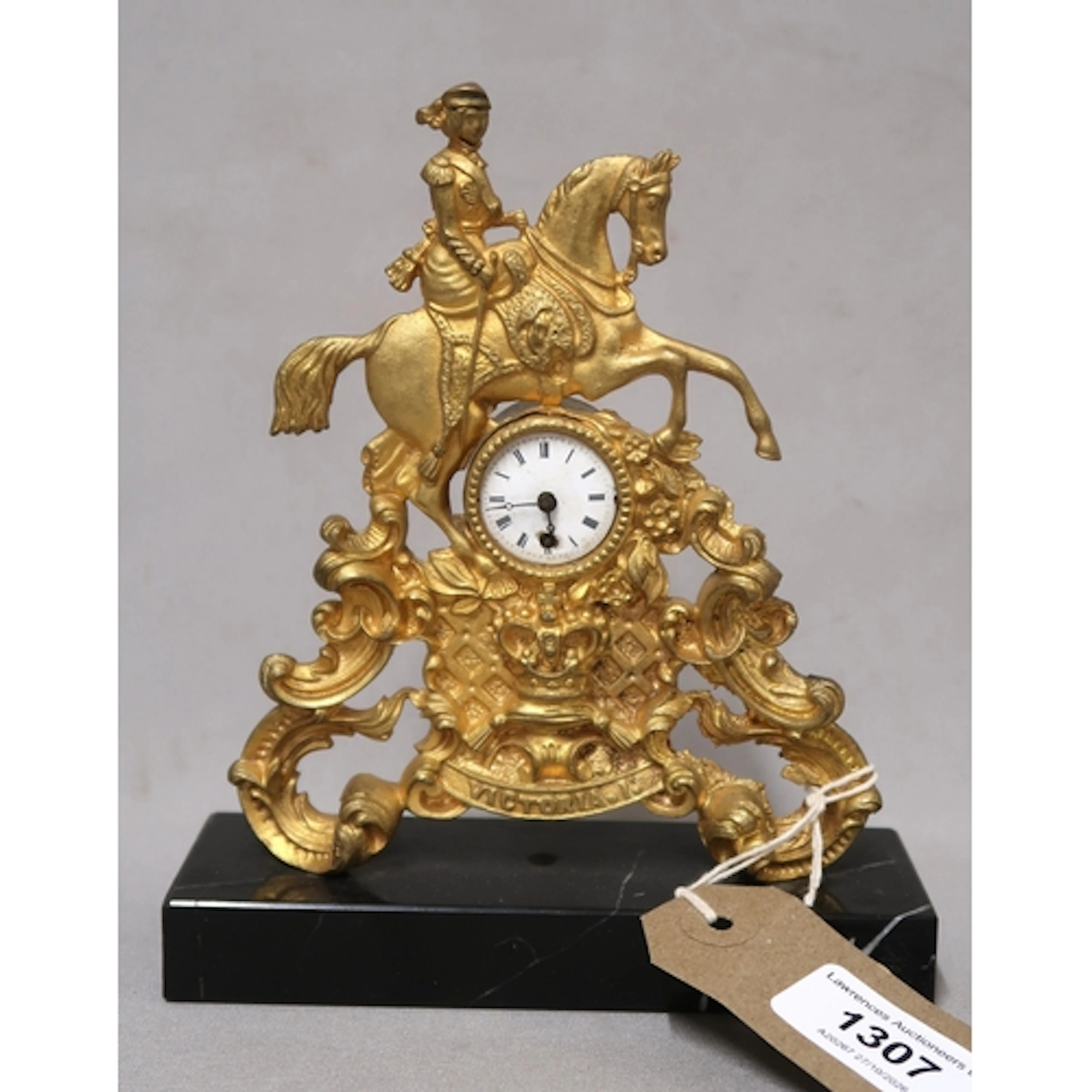 Victorian gilt metal commemorative mantel timepiece, with ke...