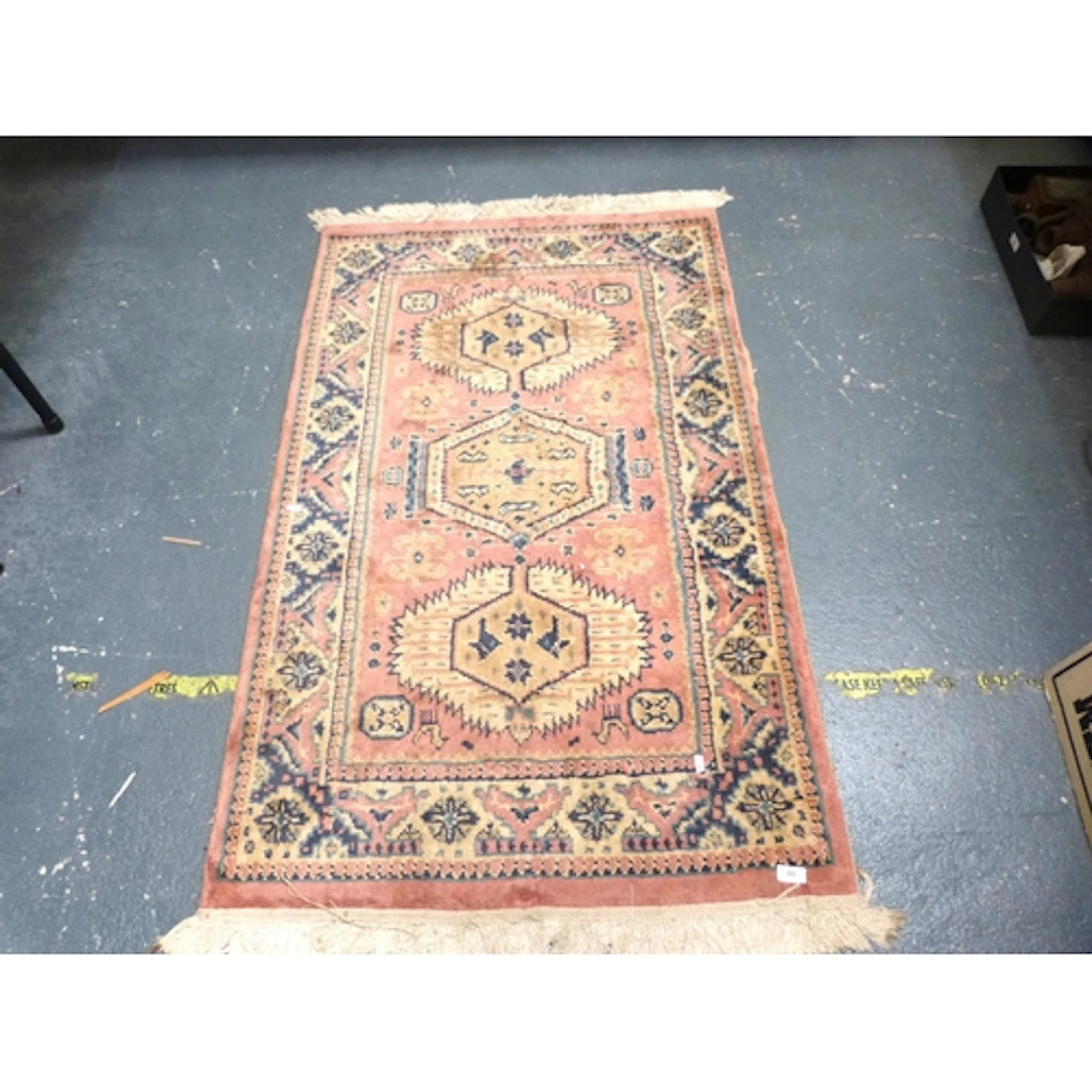 Vintage pink and cream Middle Eastern rug.