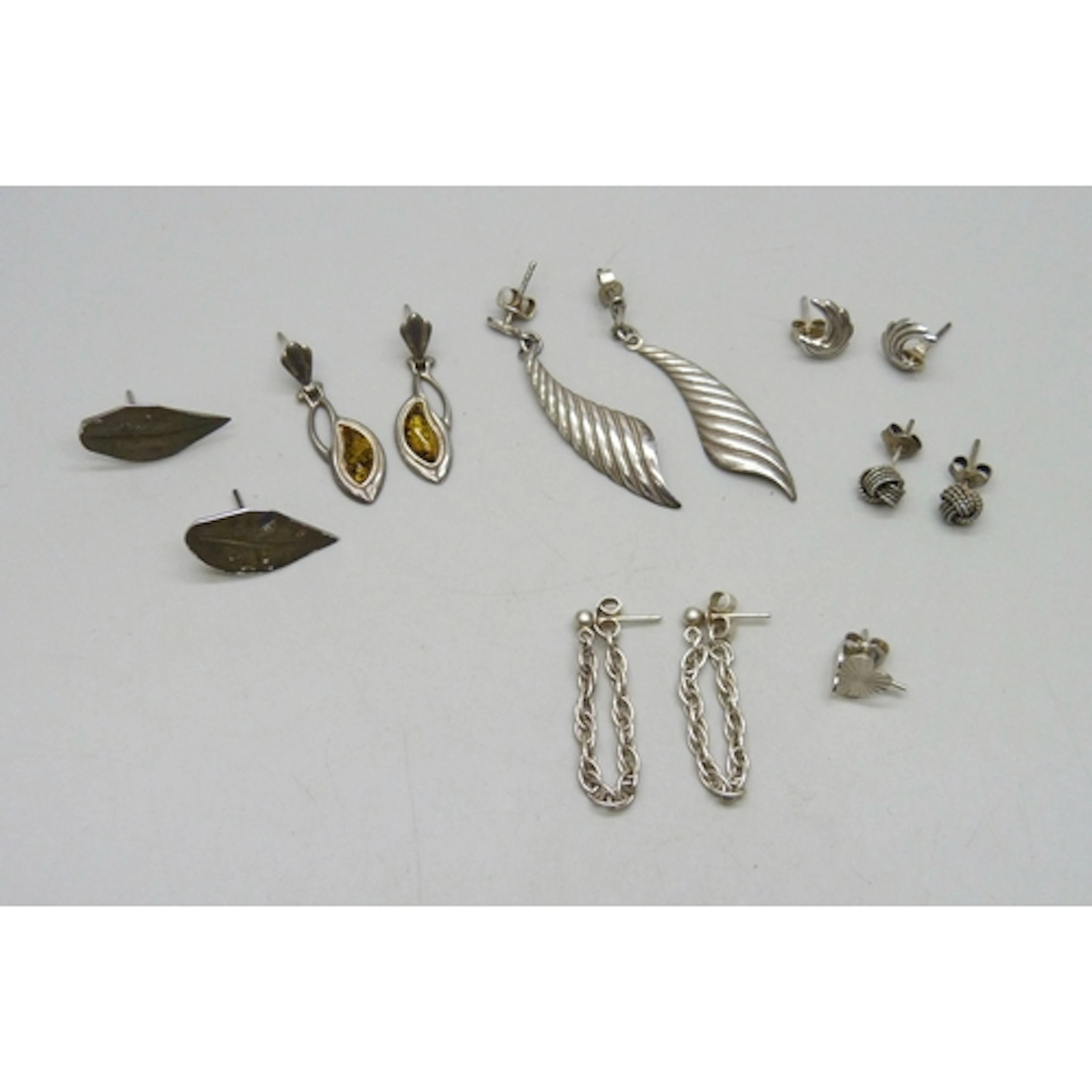 A collection of silver and white metal earrings, 11g total