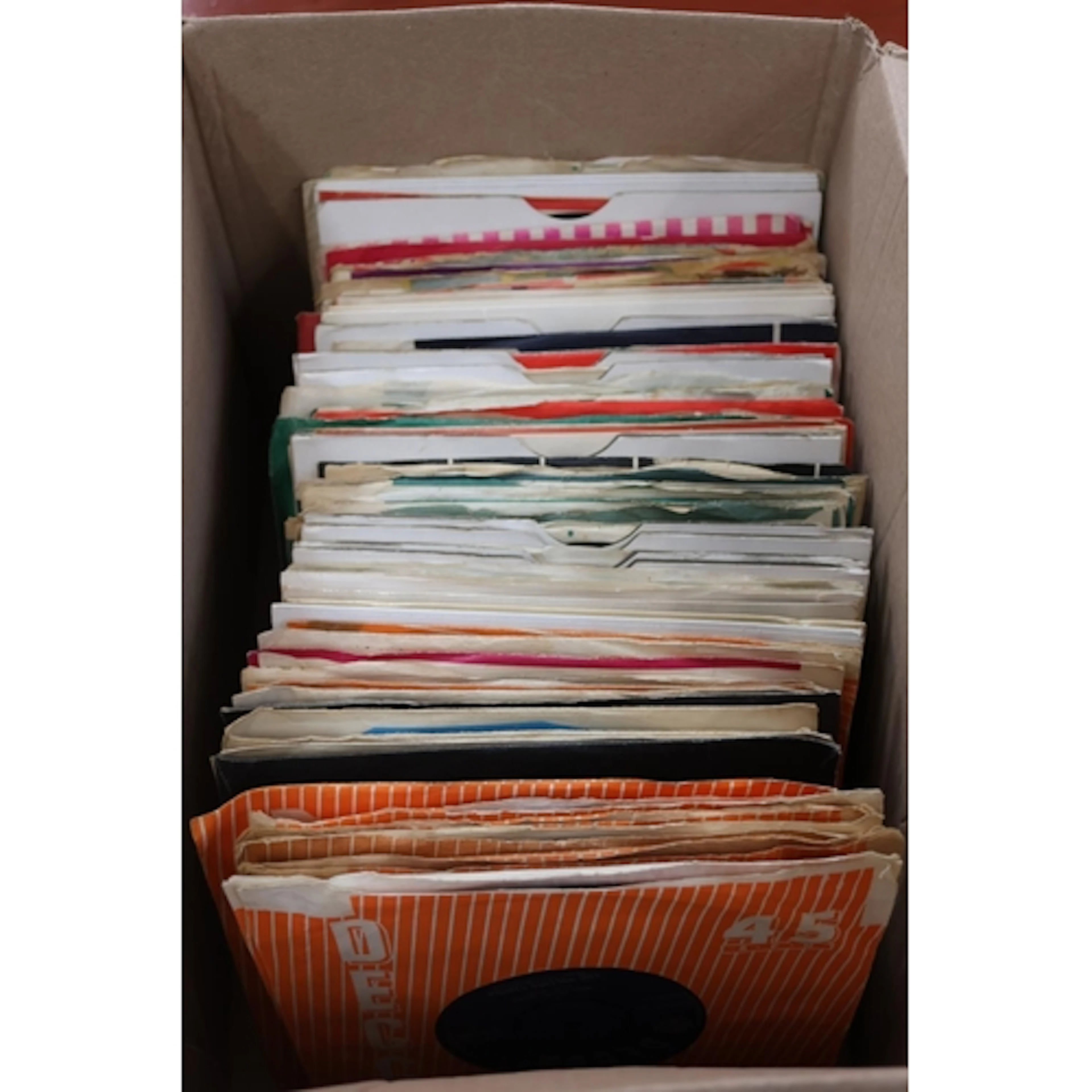 Box of mixed 7'' singles to include The Beatles and The Roll...