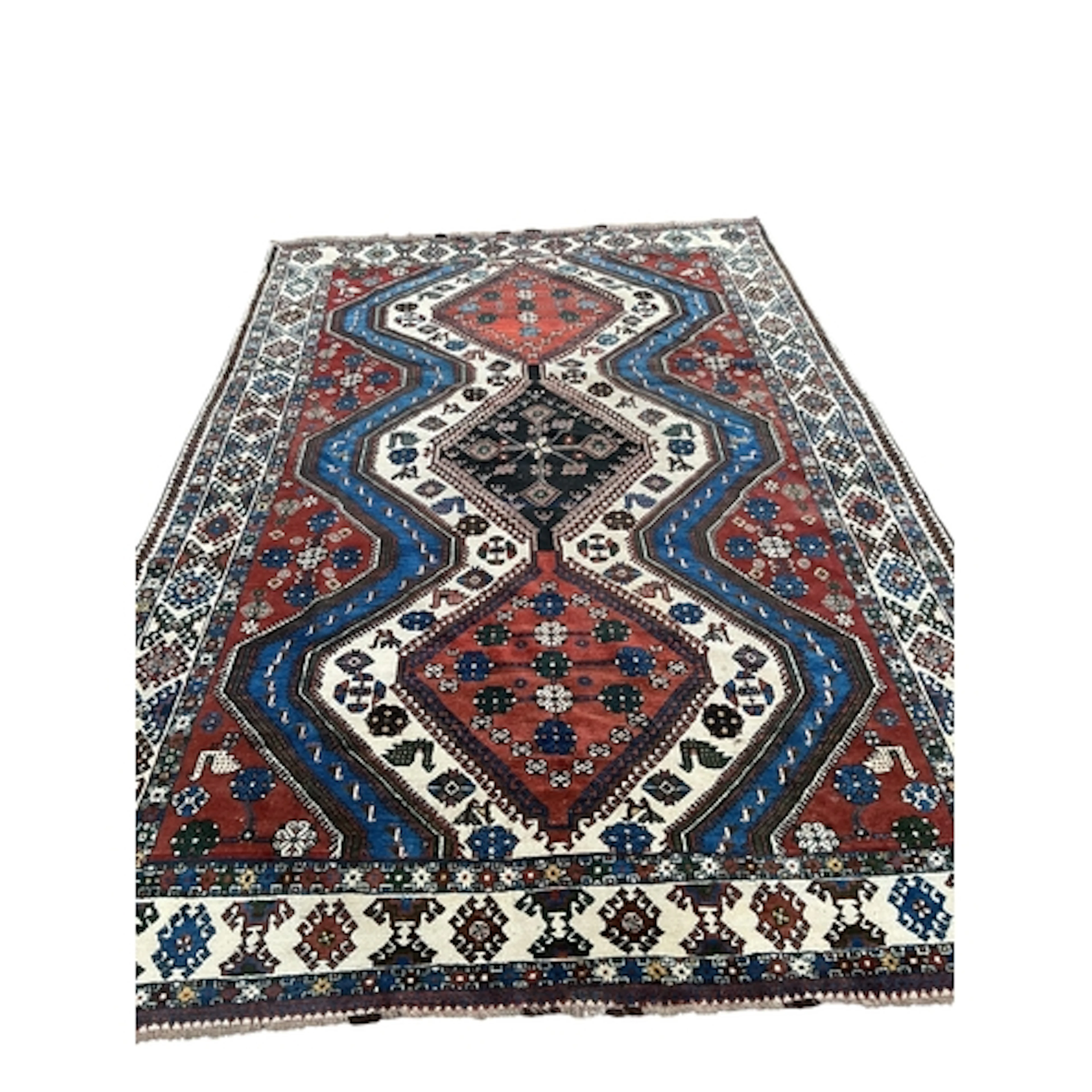 A Caucasian ivory ground carpet, 335 x 222cm