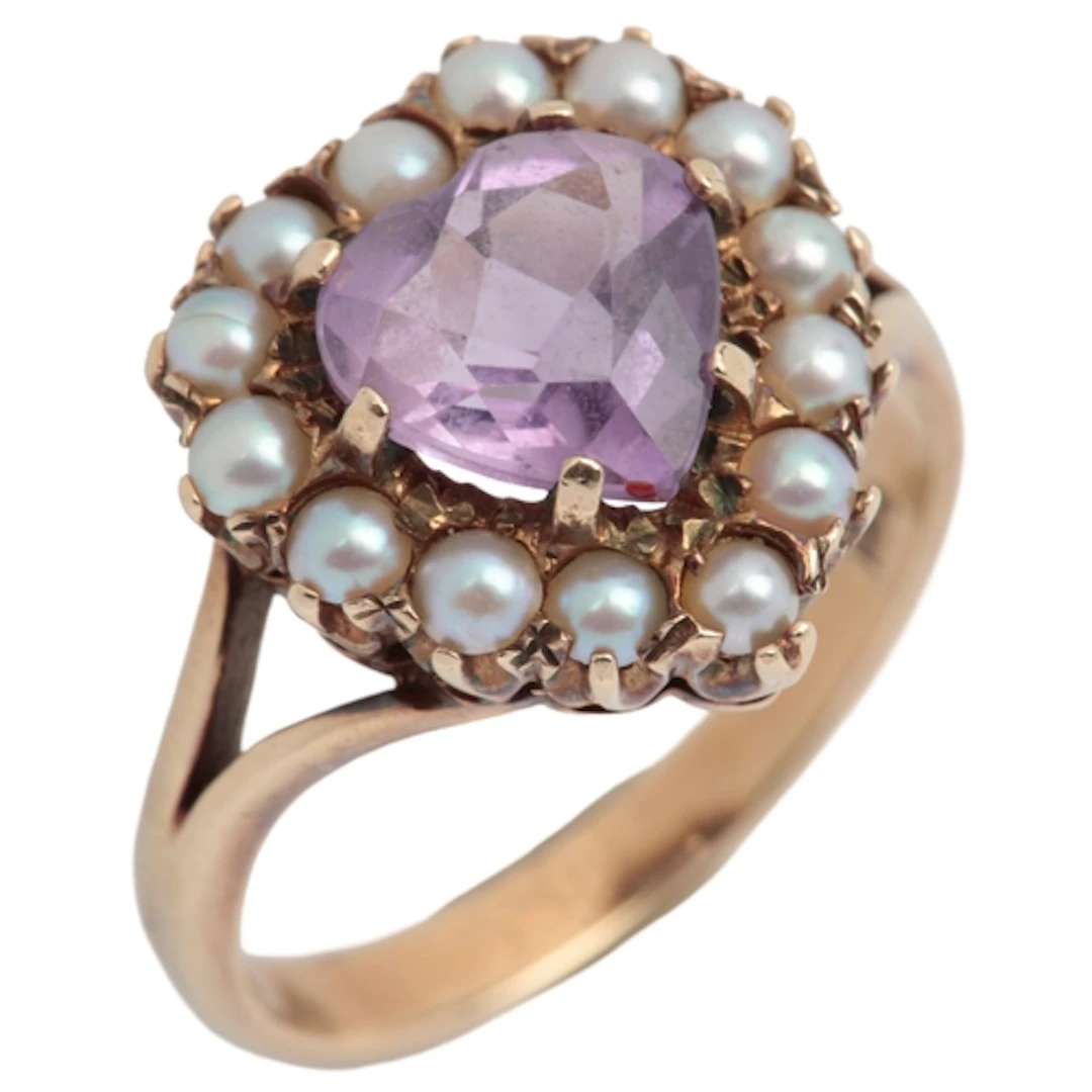 An amethyst and seed pearl cluster ring, claw-set with a hea...