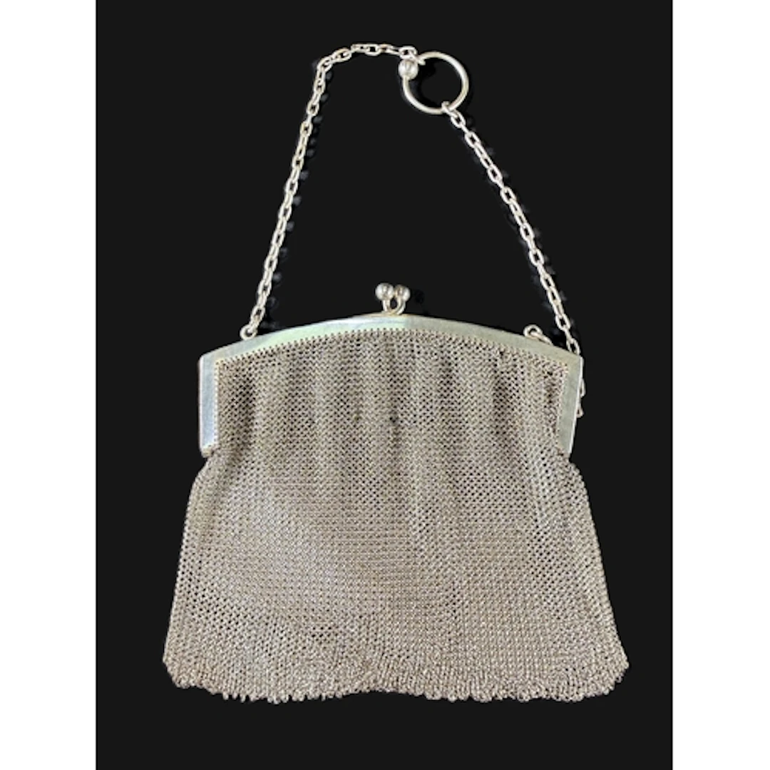 A hallmarked silver mesh chain mail evening purse, with chai...