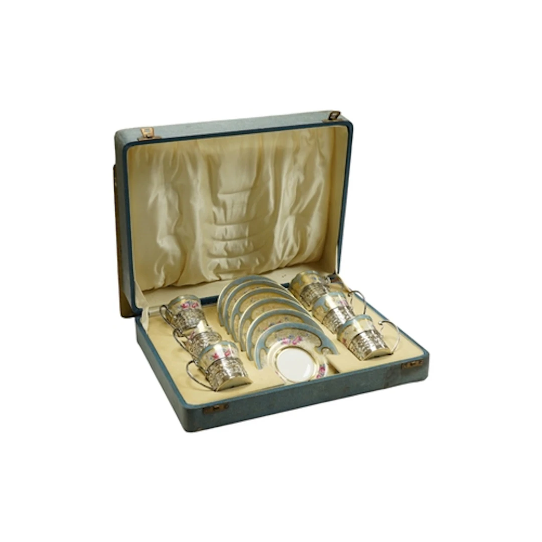 A George V cased set of six silver mounted Paragaon coffe ca...
