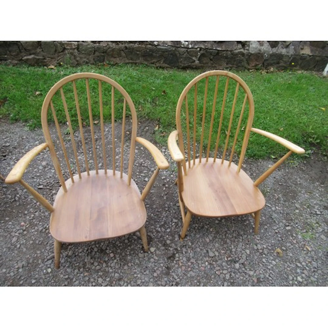 A pair of ercol open arm chairs