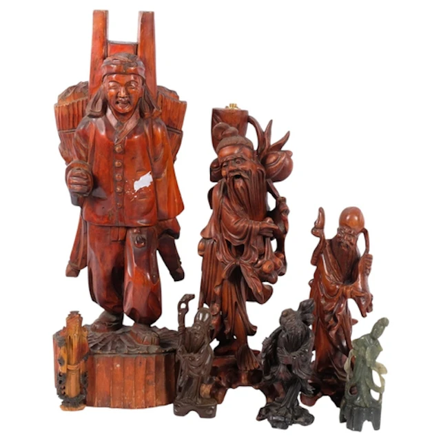 A collection of Chinese carved wood figures and soapstone ca...