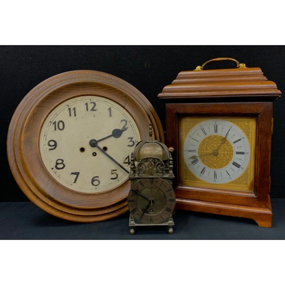 A 17th century style brass lantern clock; a circular wall c...