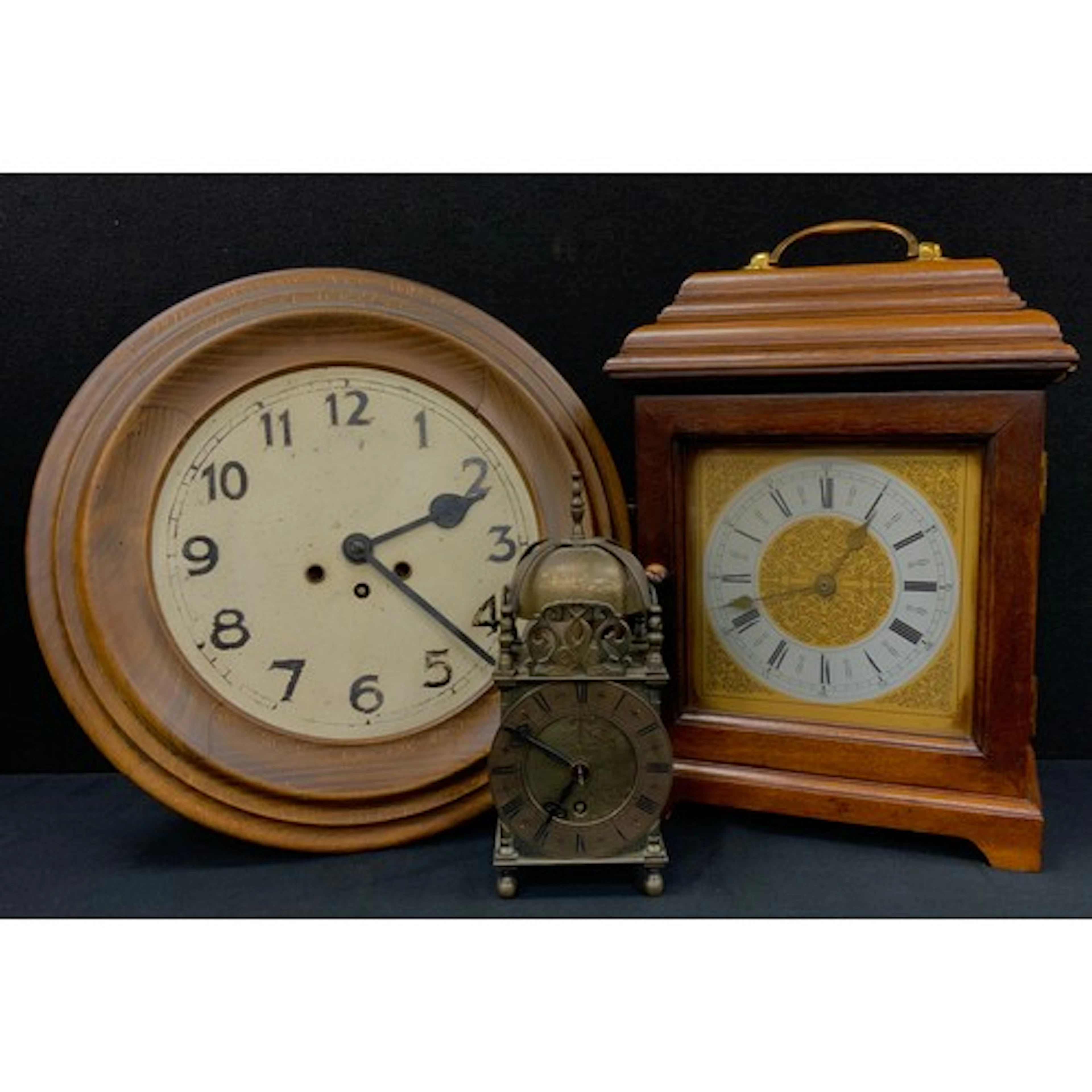 A 17th century style brass lantern clock; a circular wall c...