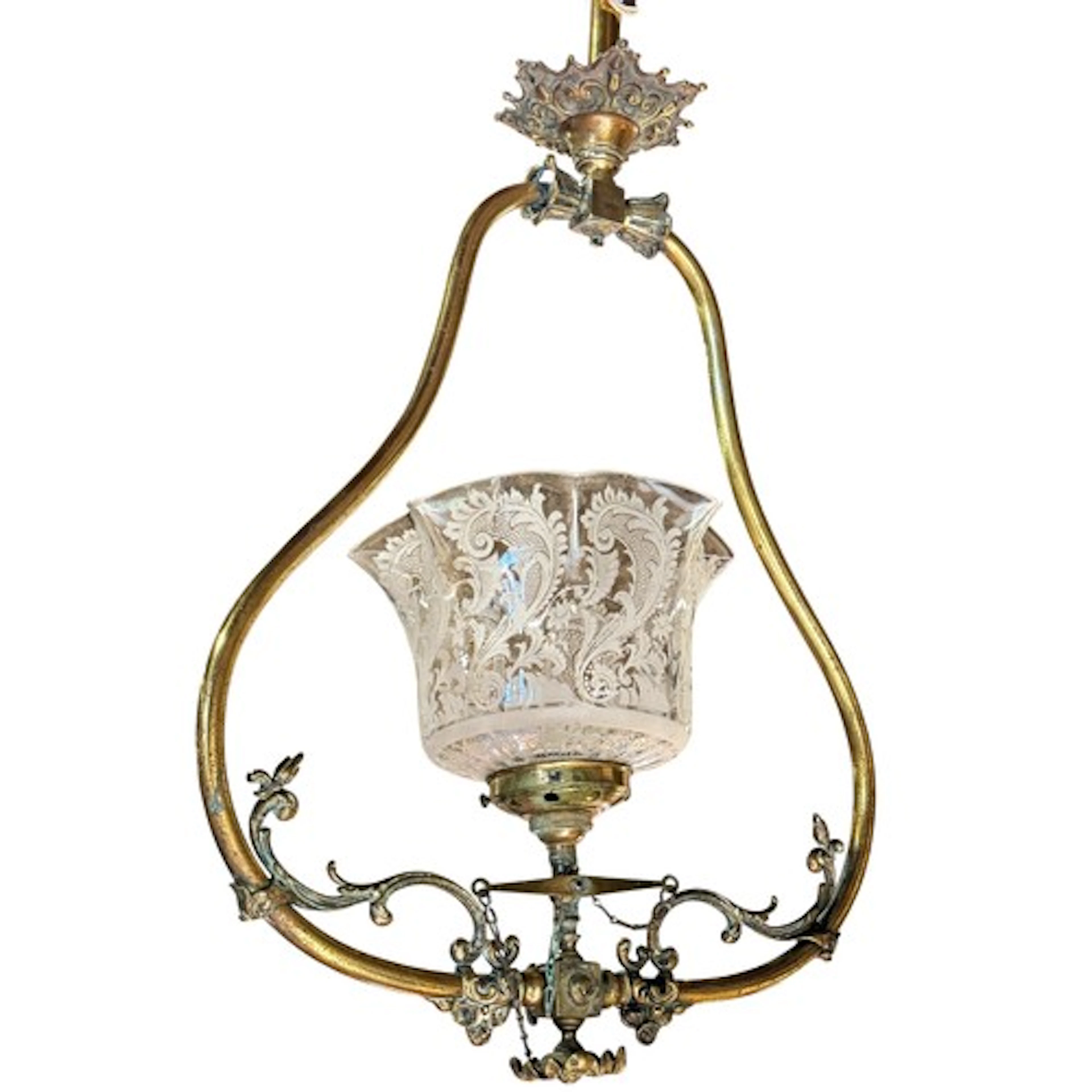 An early 20th century brass rise and fall hanging ceiling li...