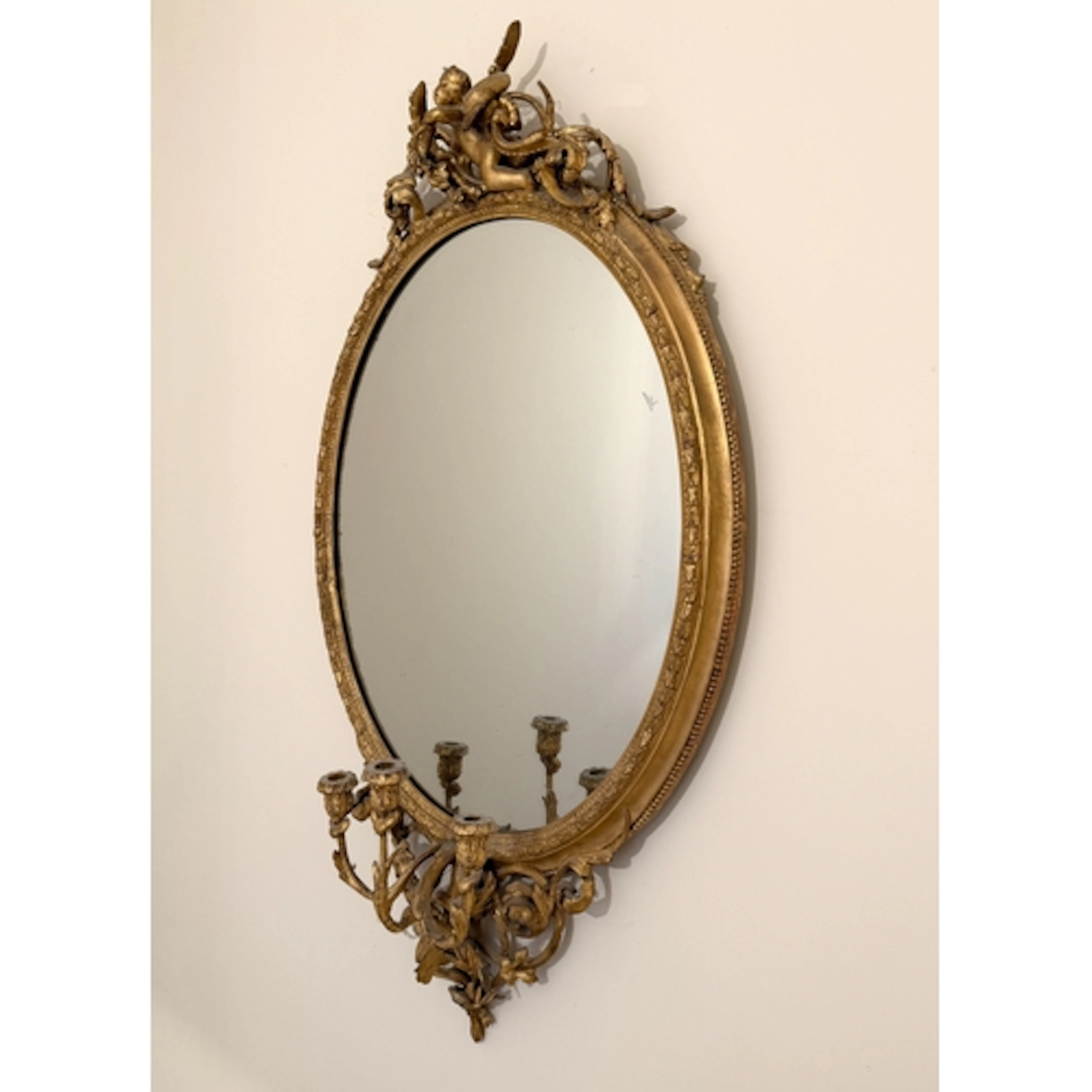 A good 19th century gilt and composition oval girandole mirr...