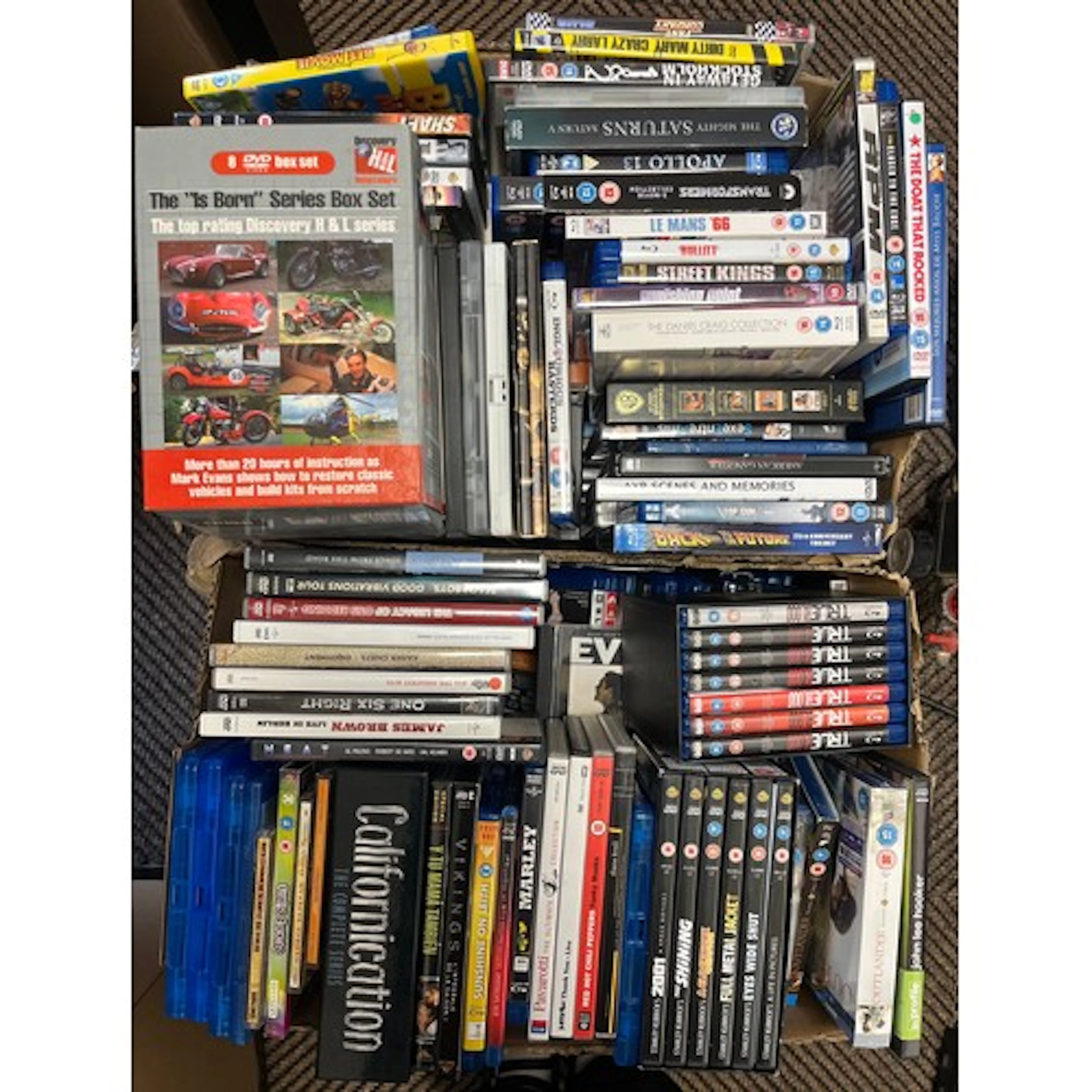 Two boxes of assorted DVD, box sets, Blue Ray DVDs, etc.