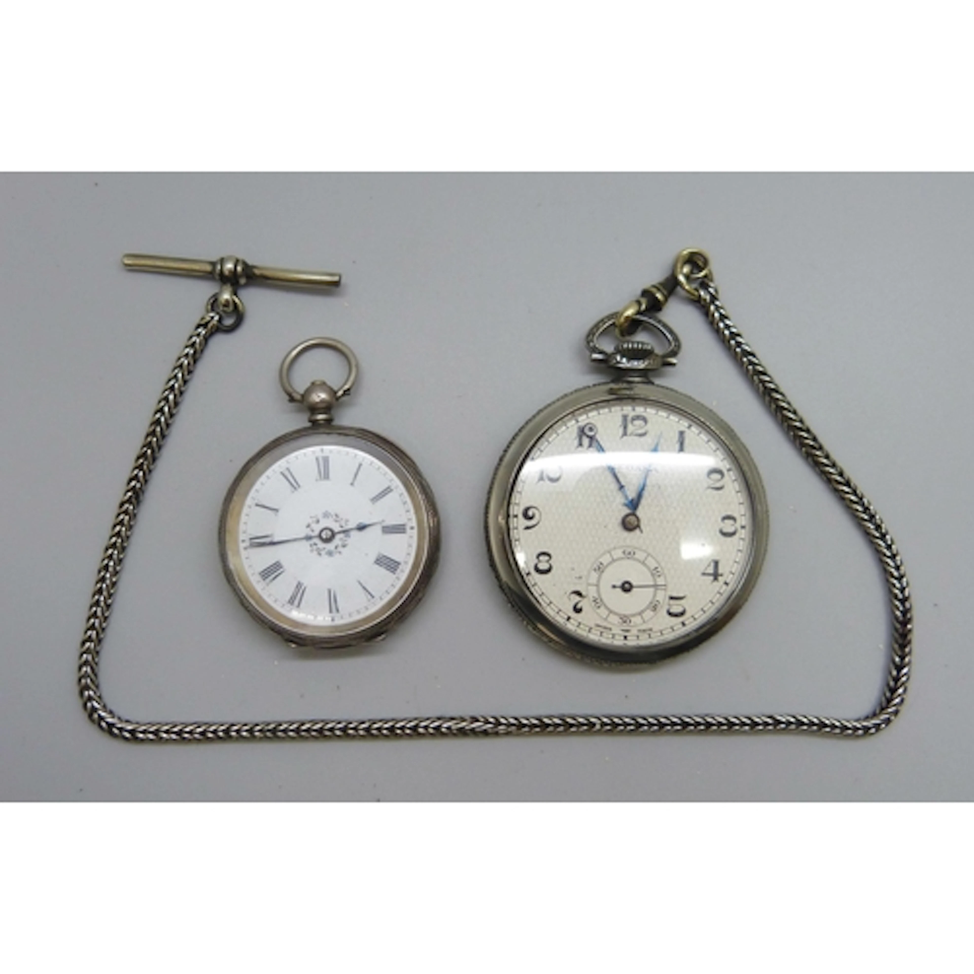 A .935 silver fob watch, and a plated Medana watch on a plat...