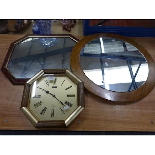 Two vintage wall mirrors and a wall clock. (3)