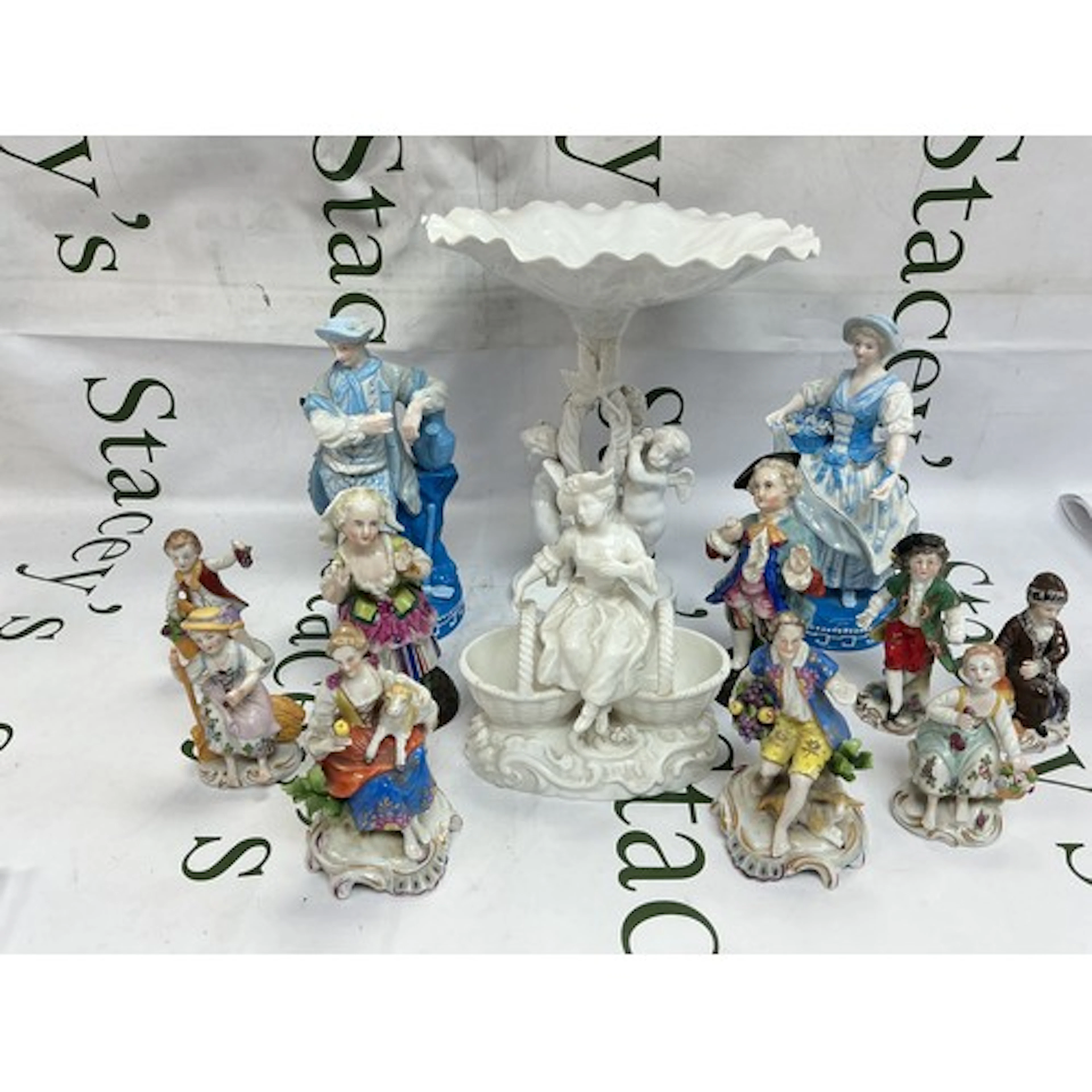 A collection of various Continental porcelain figures plus a...