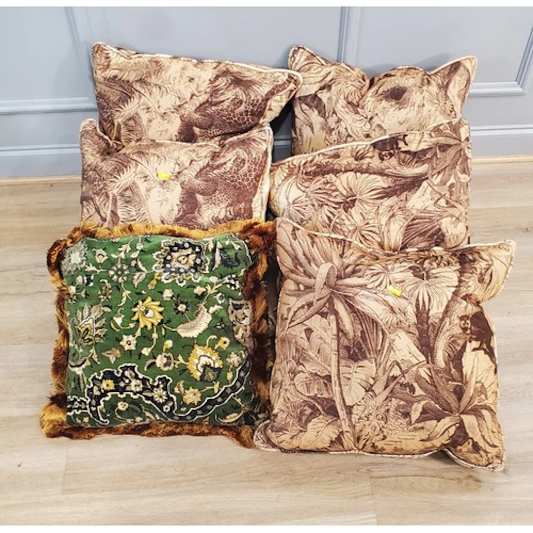 A quantity of Cushions decorated with floral and leafage des...
