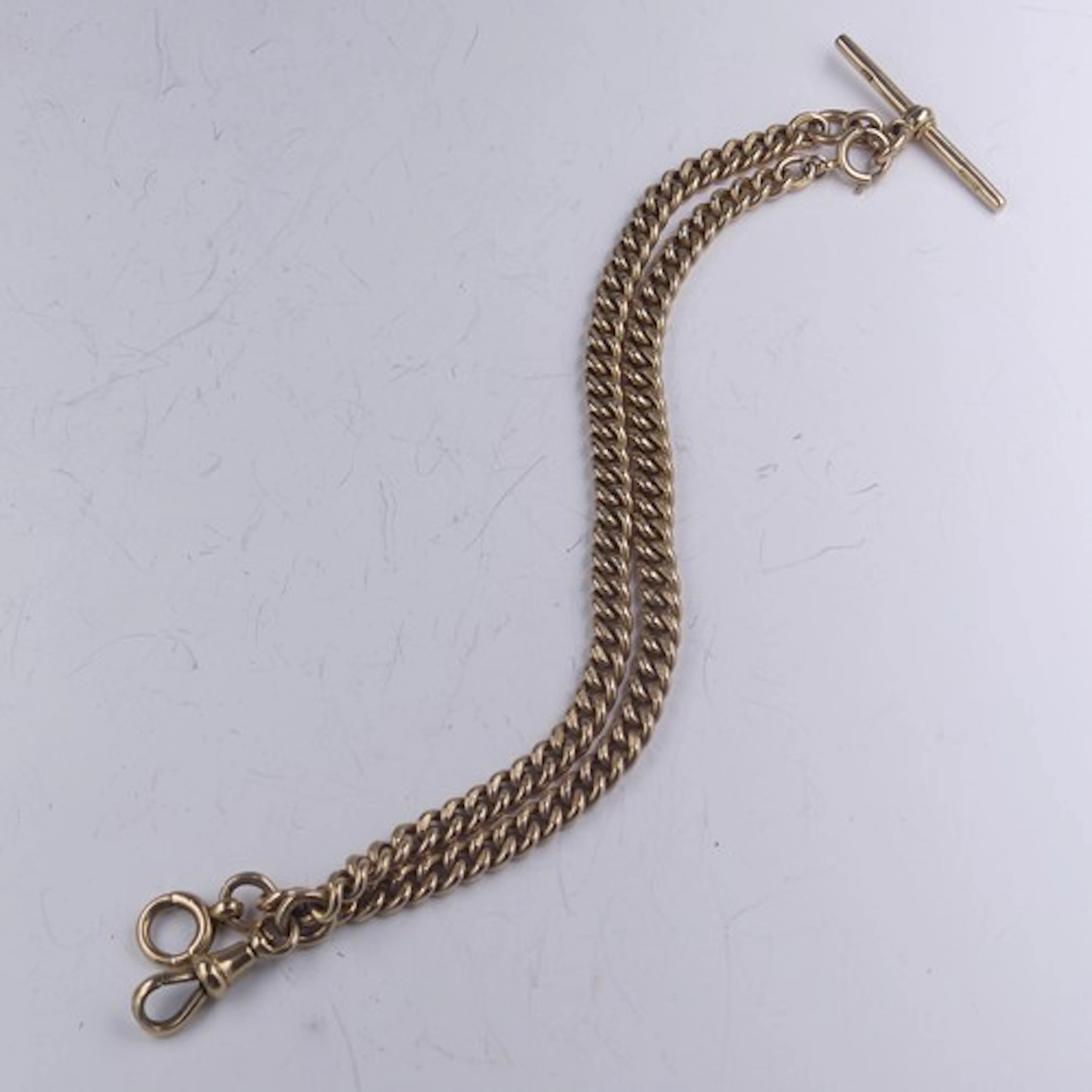 A 9ct yellow gold 'Albert' Watch Chain, the curblink chain s...