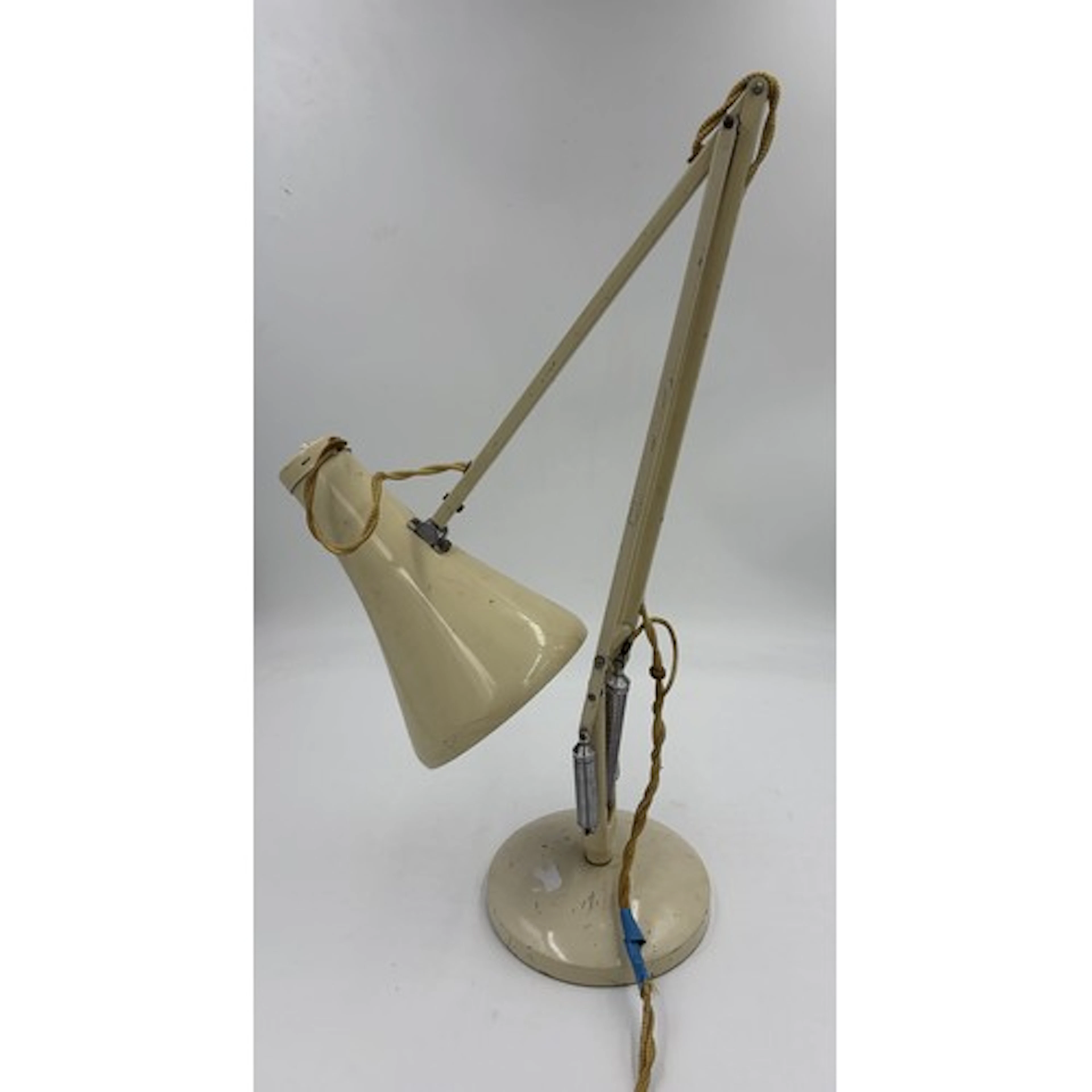 Anglepoise lamp with label 'Anglepoise Trademark' cream colo...