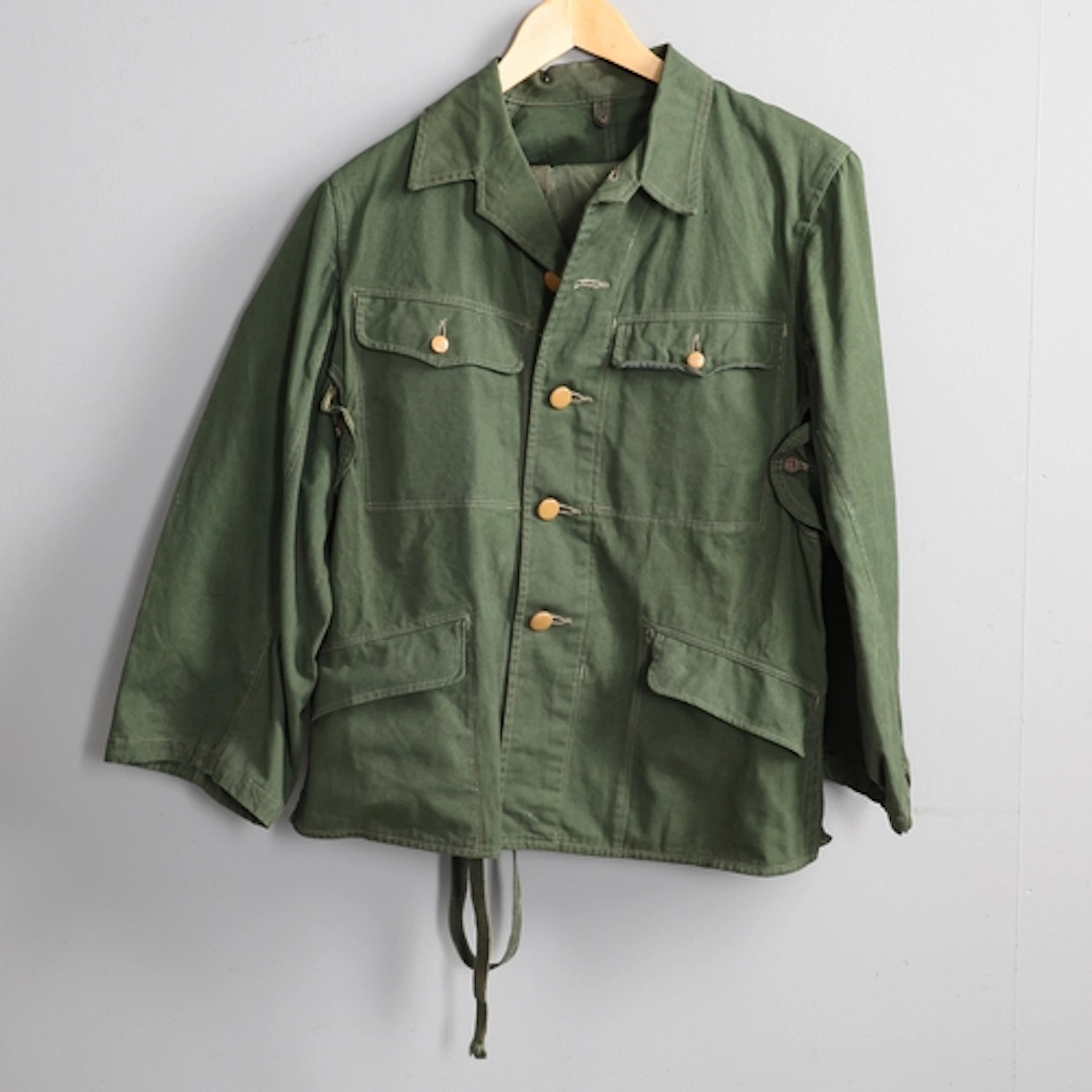 A SECOND WORLD JAPANESE UNIFORM JACKET, TROUSERS AND PUTTEES...