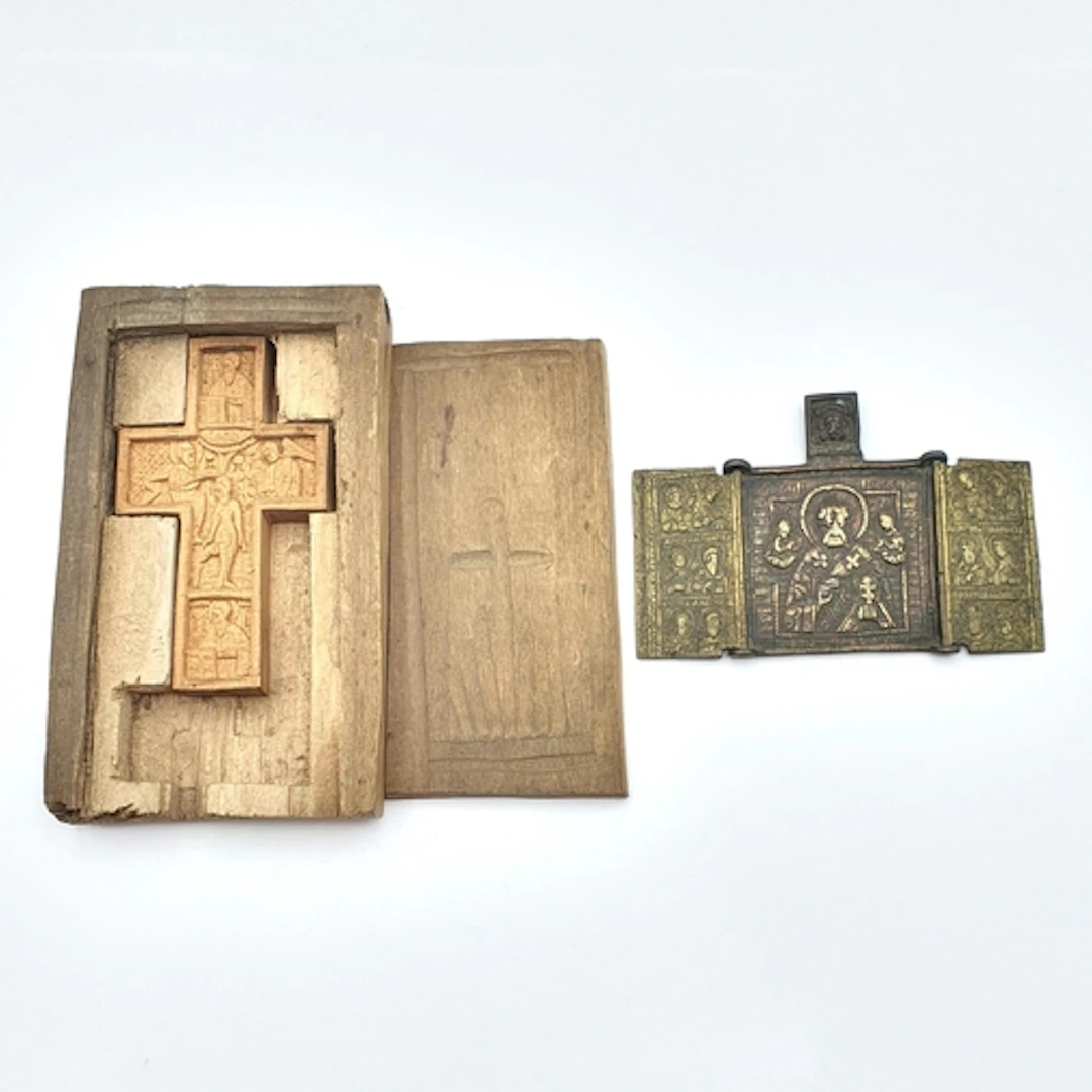 A brass Russian Triptych Icon and a Wooden Cross ornately ca...