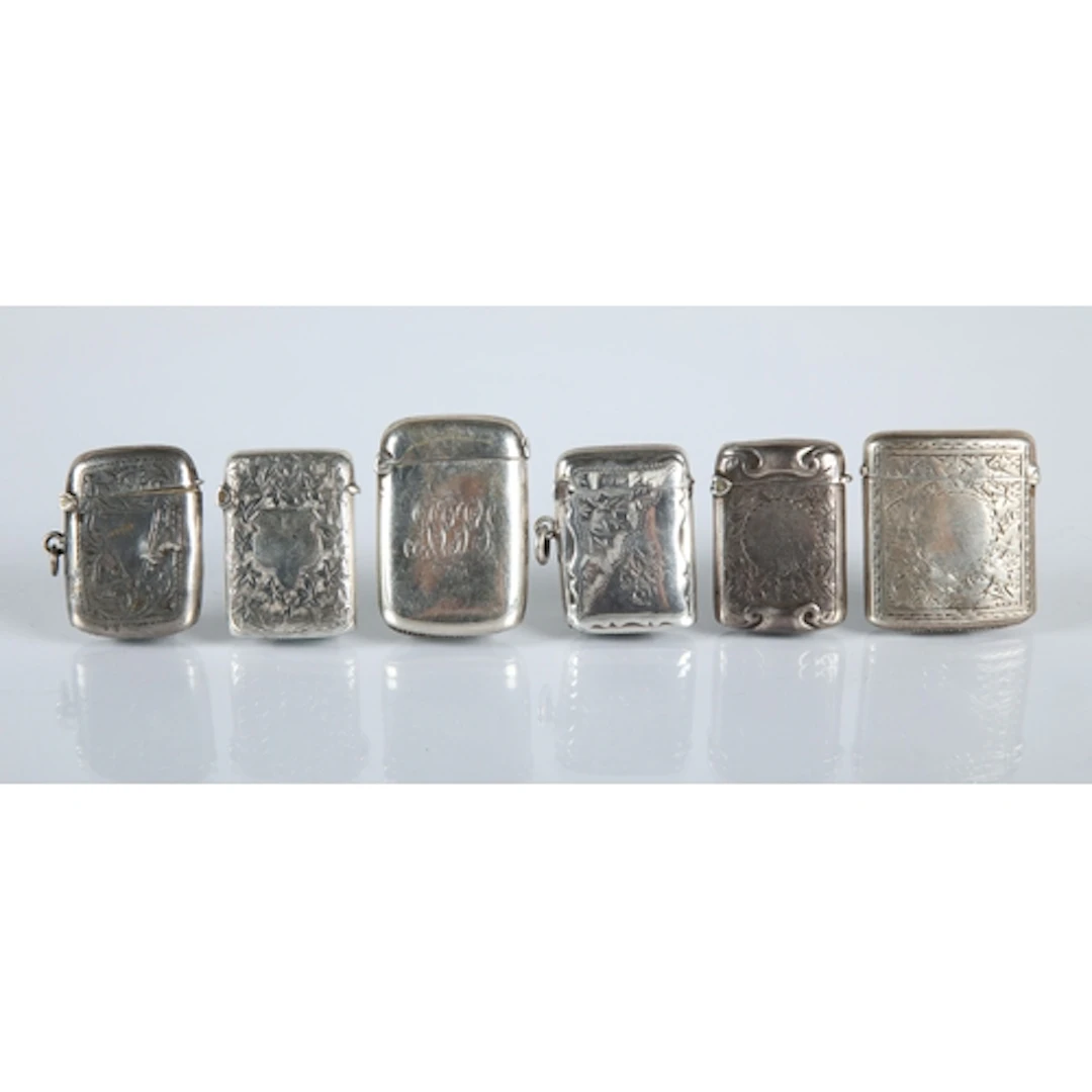 Six silver engraved vesta cases, gross weight 87.7g.