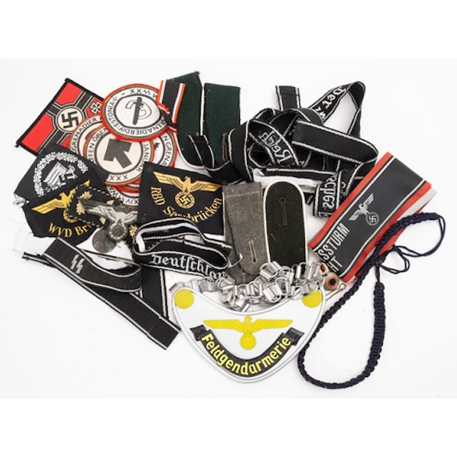 A group of various German Army badges and re-enactment insig...