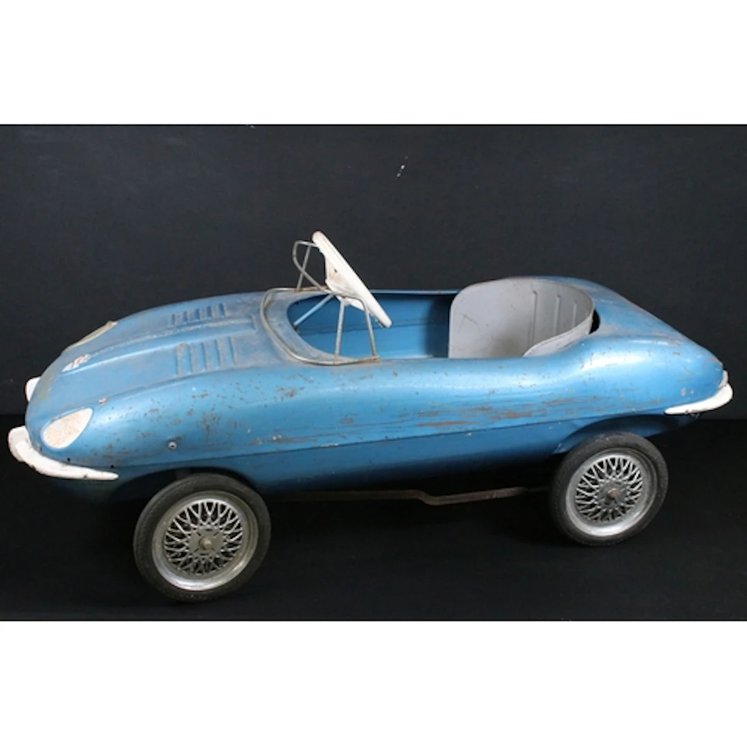 Original Triang E Type Jaguar pedal car in blue, shows rusti...