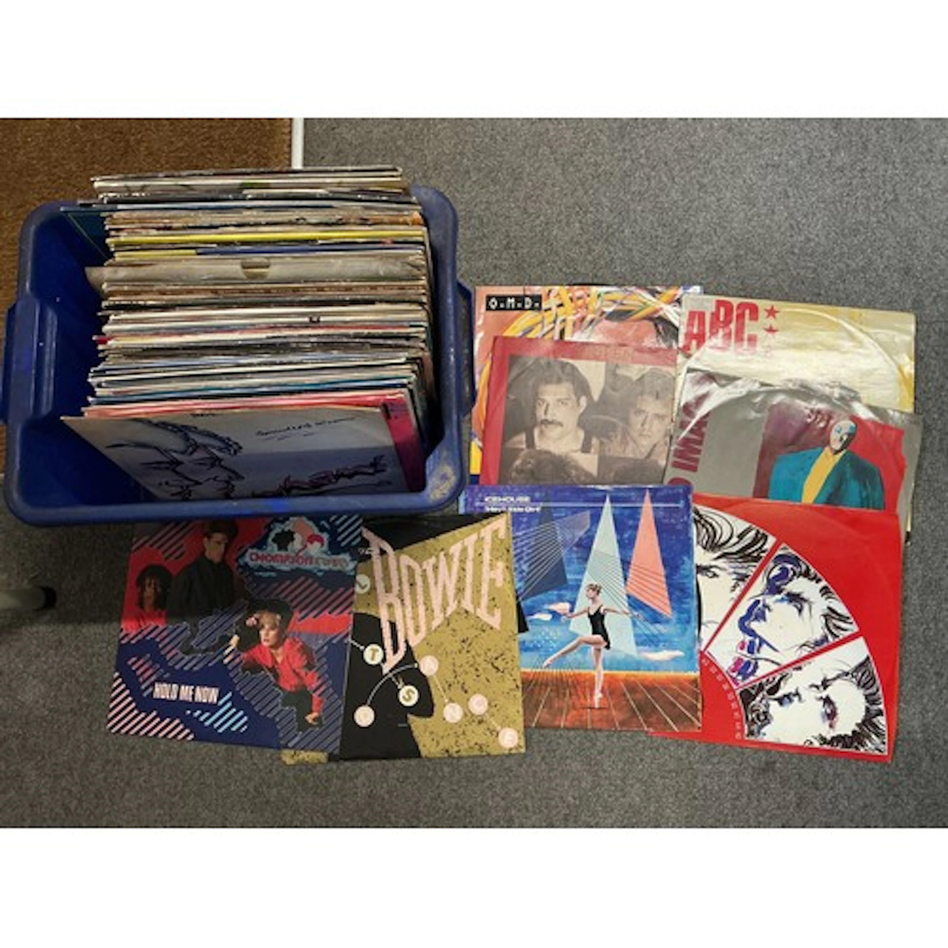 A box of 12” singles by various artists including David Bowi...
