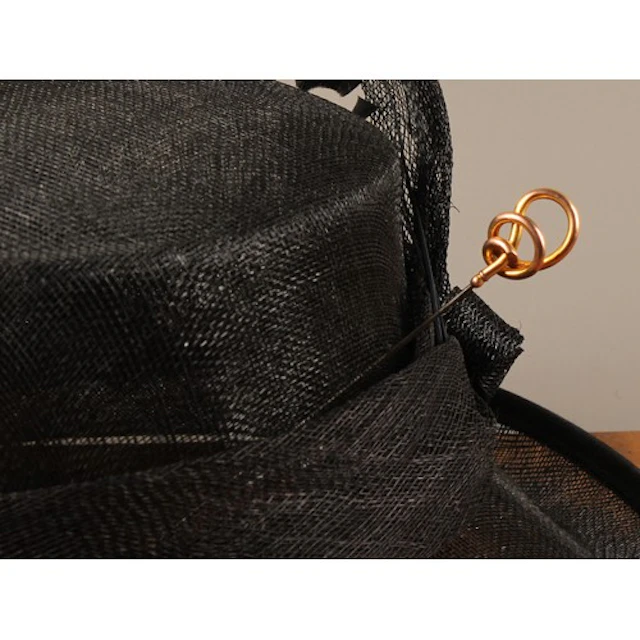 An Edwardian Charles Horner 9ct gold scroll topped hat pin, ...