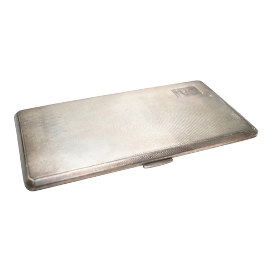 A George VI engine turned silver cigarette case, Birmingham...