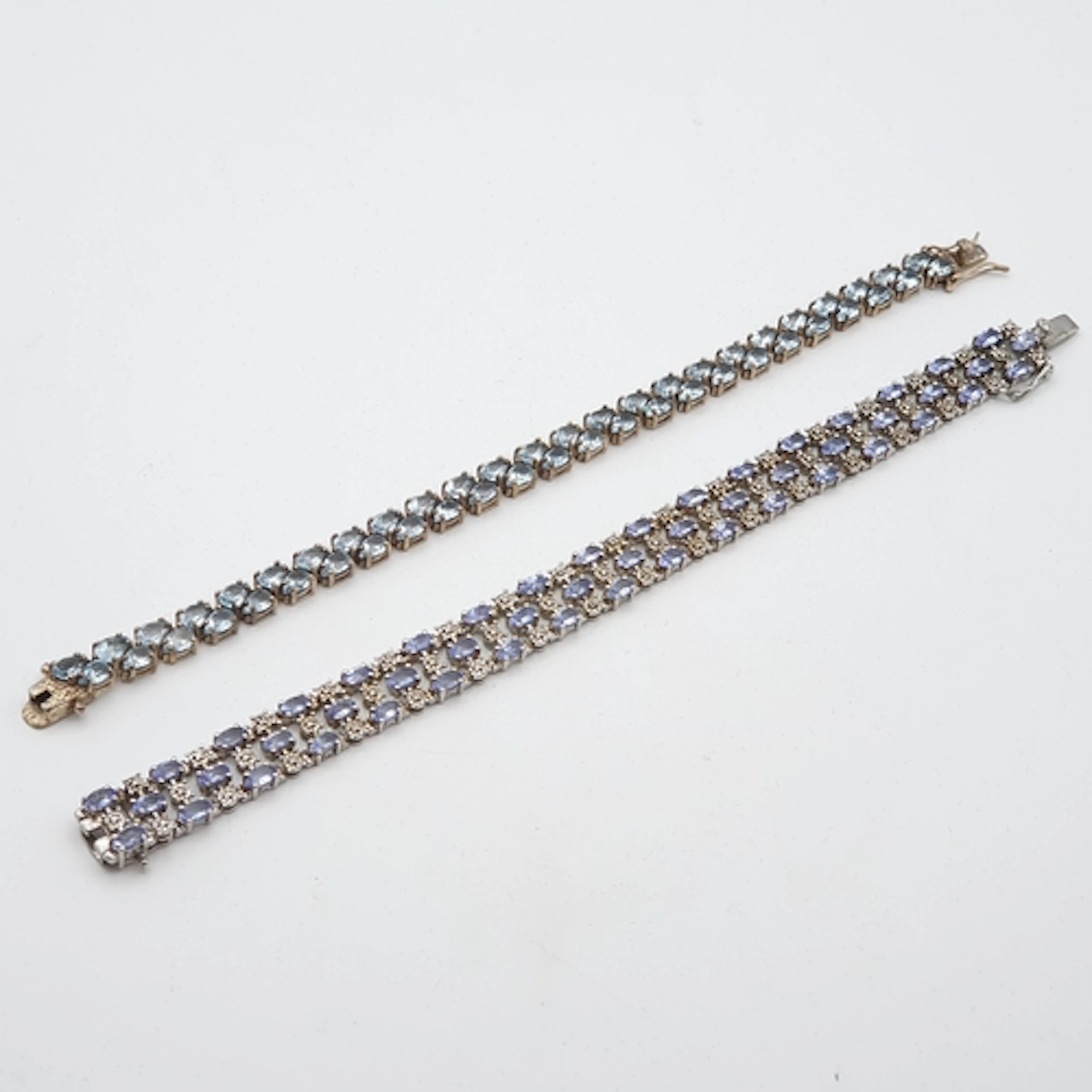 A Tanzanite and CZ Bracelet and a blue Topaz Bracelet, both ...