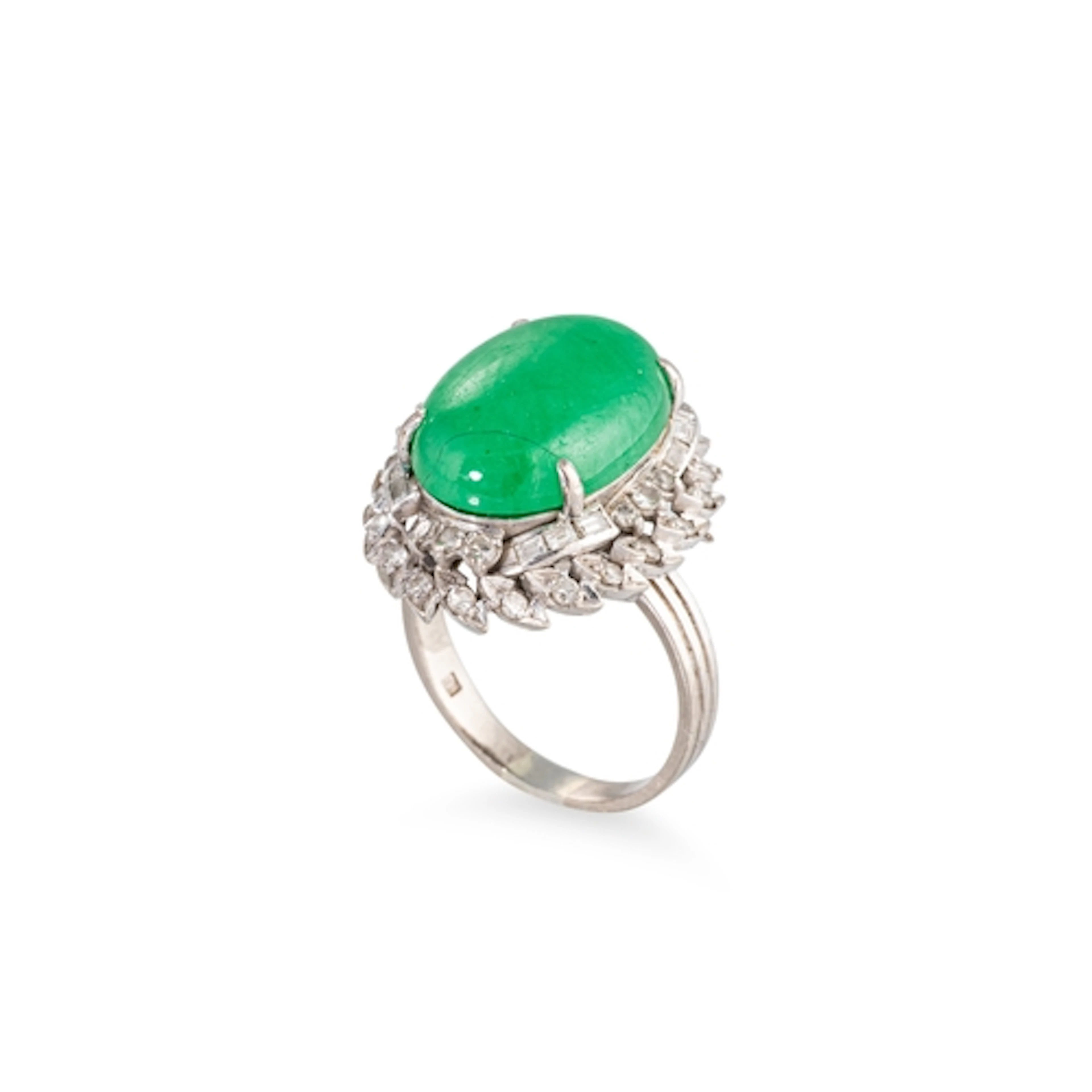A VINTAGE JADE AND DIAMOND RING, the cabochon jade to diamon...