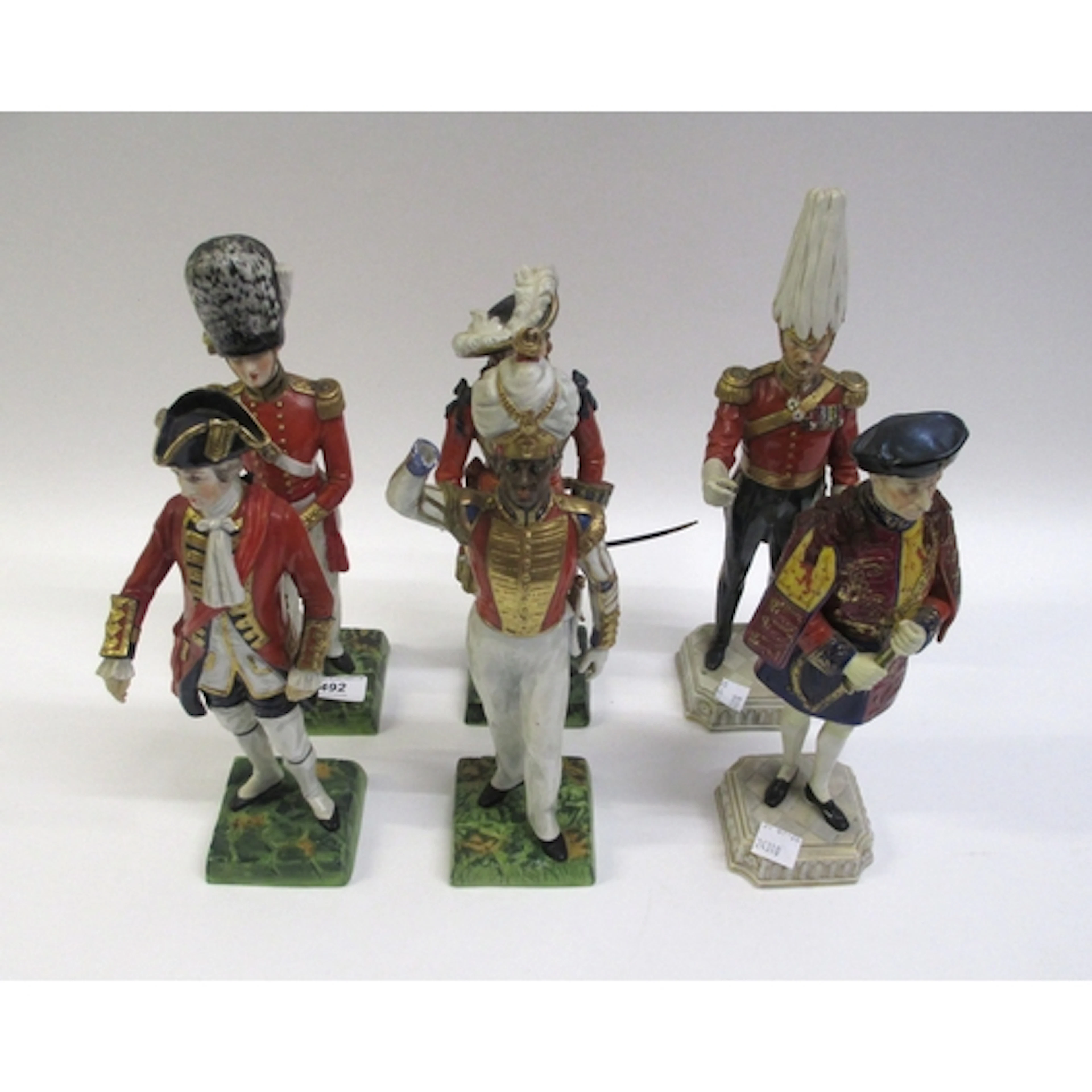 Set of four late Dresden porcelain figures, of military offi...